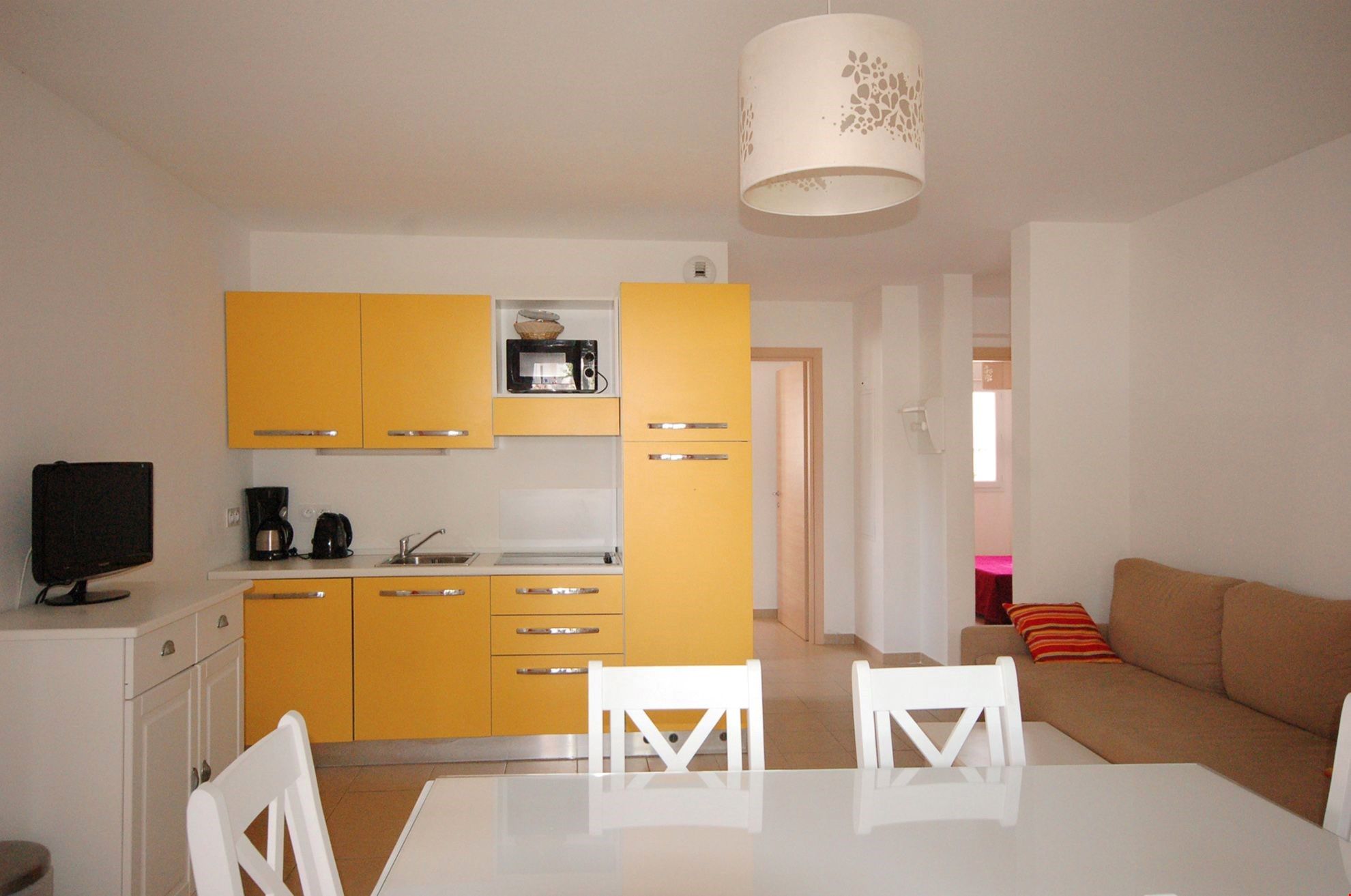image Relax in the colourful open-concept living area after an exciting day outside