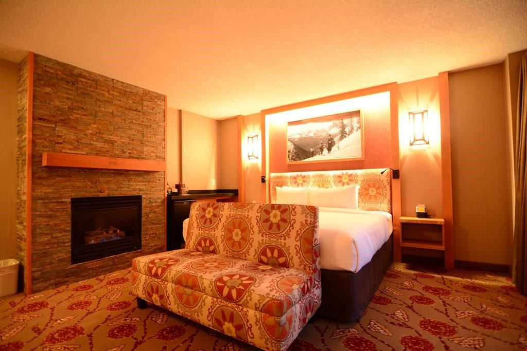 image Relax in this stunning, newly renovated room and warm up next to the fire after a long day outside.