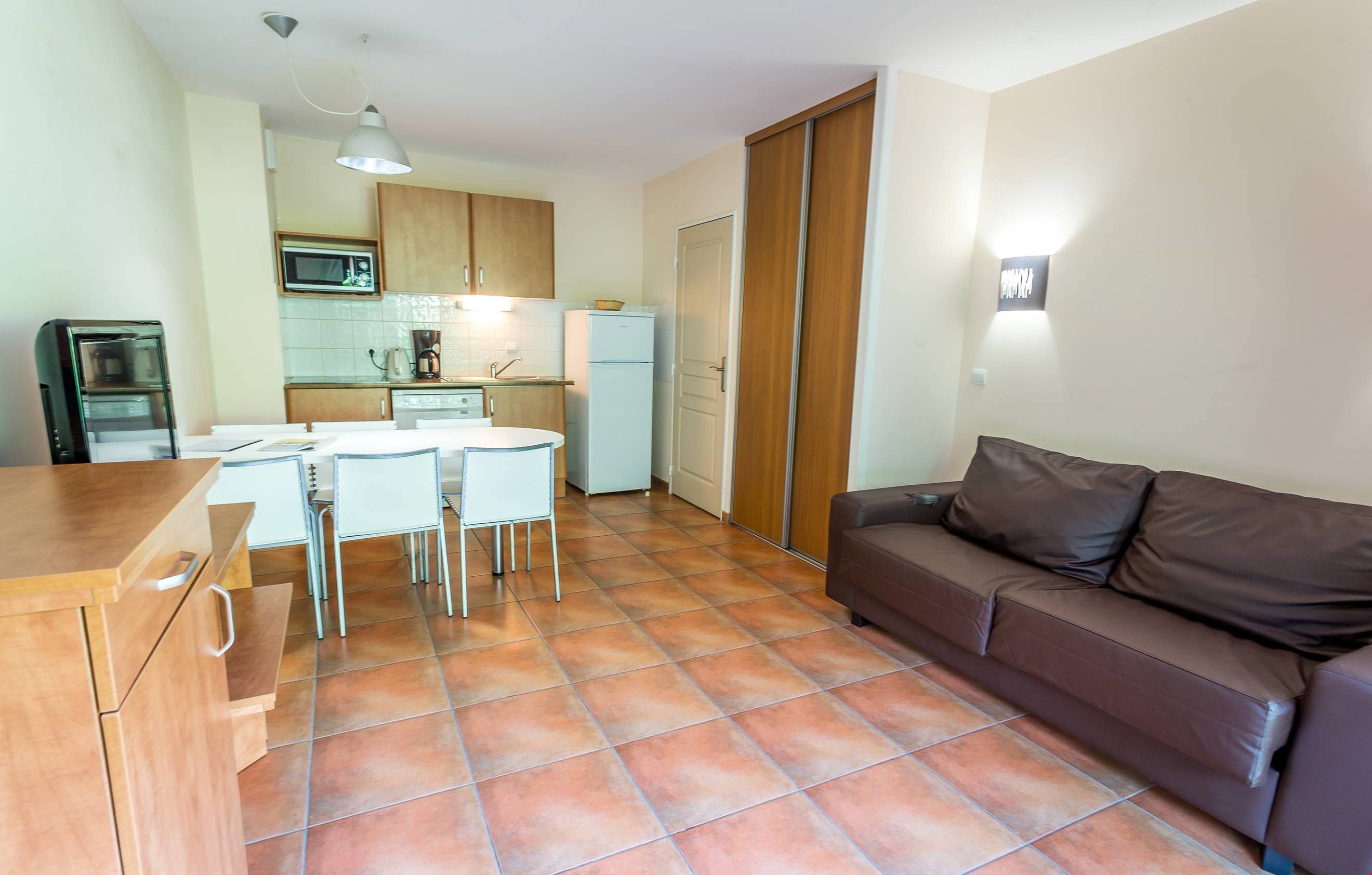 image Prepare delicious meals for your friends and family in your personal kitchenette and enjoy your meals in the dining area with seating for your group.