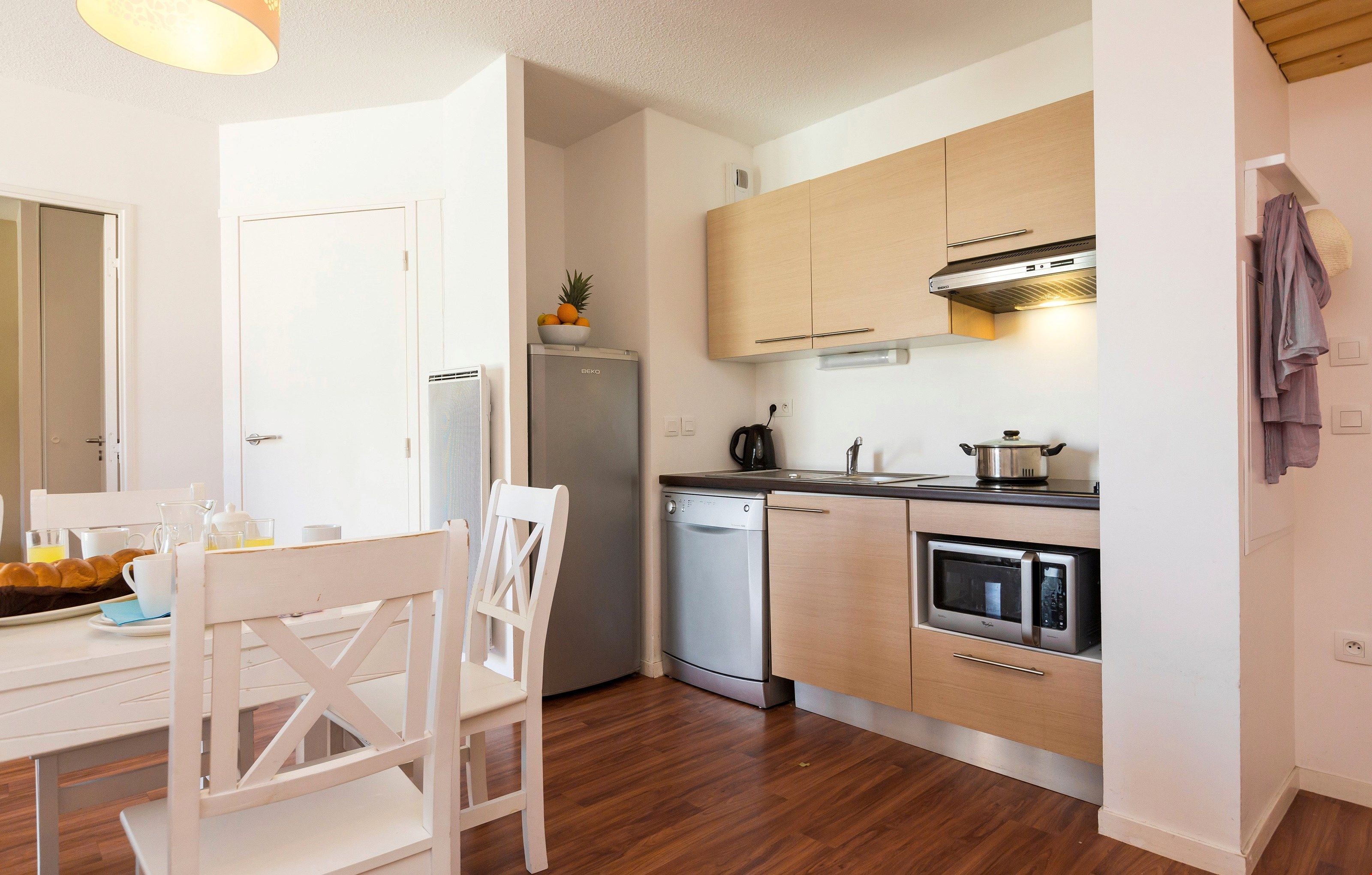 image Prepare delicious meals for your friends and family in your personal kitchenette and enjoy your meals in the dining area with seating for your group.