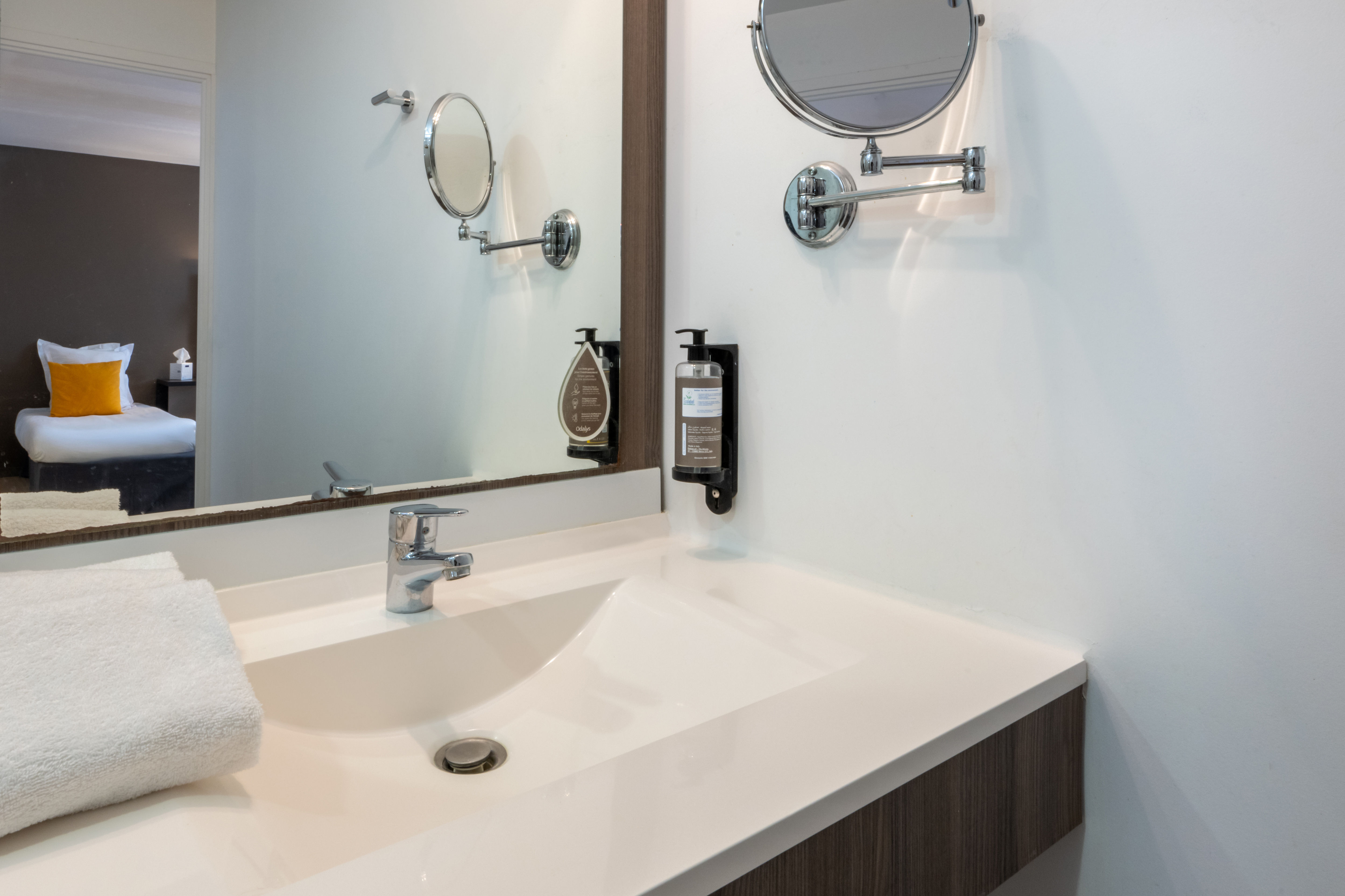 image Highlighting thoughtful design, the bathroom sink area combines functionality and style with a sleek countertop, practical storage solutions, and convenient amenities, ensuring a pleasant and efficient space for personal care.