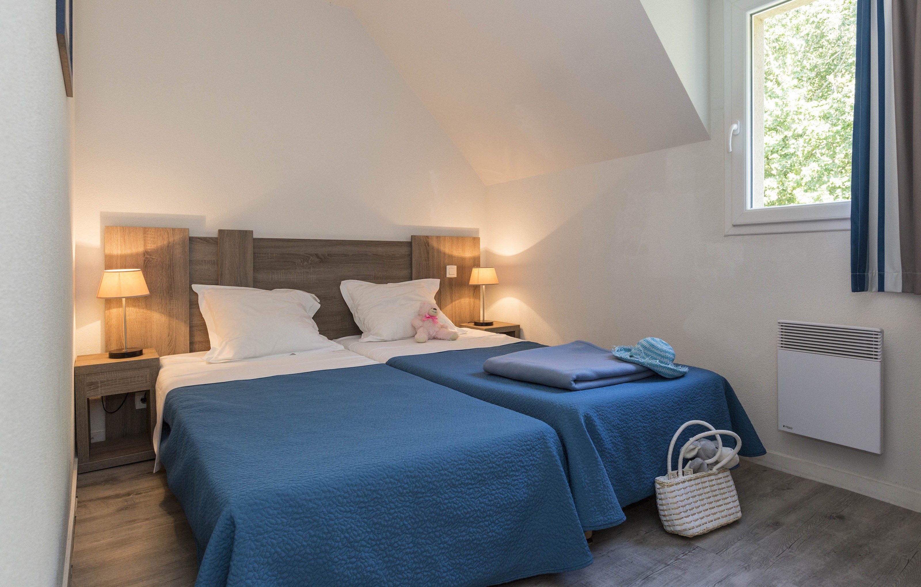 image Drift to sleep in a comfortable bed after a wonderful day outside.