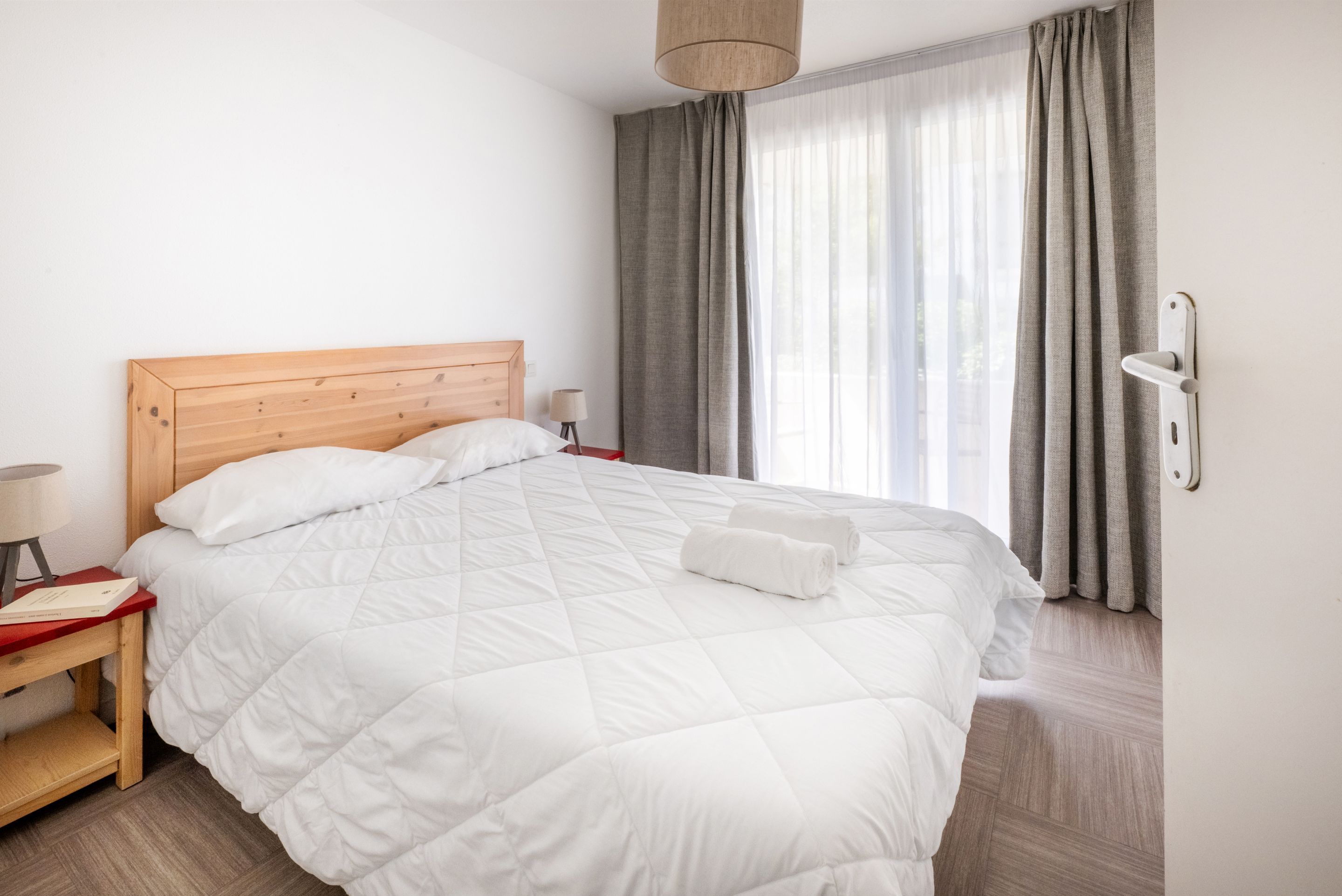 image This bedroom opens onto the balcony, just steps from the coastal path outside.