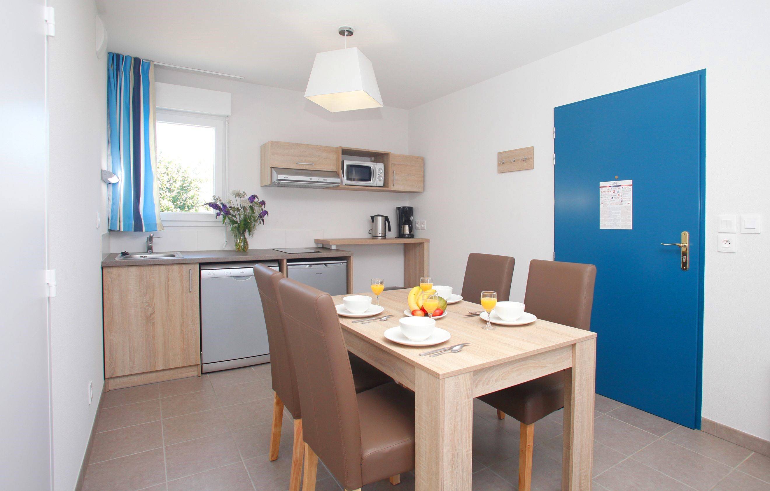 image Settle into the dining area and enjoy a nice meal.