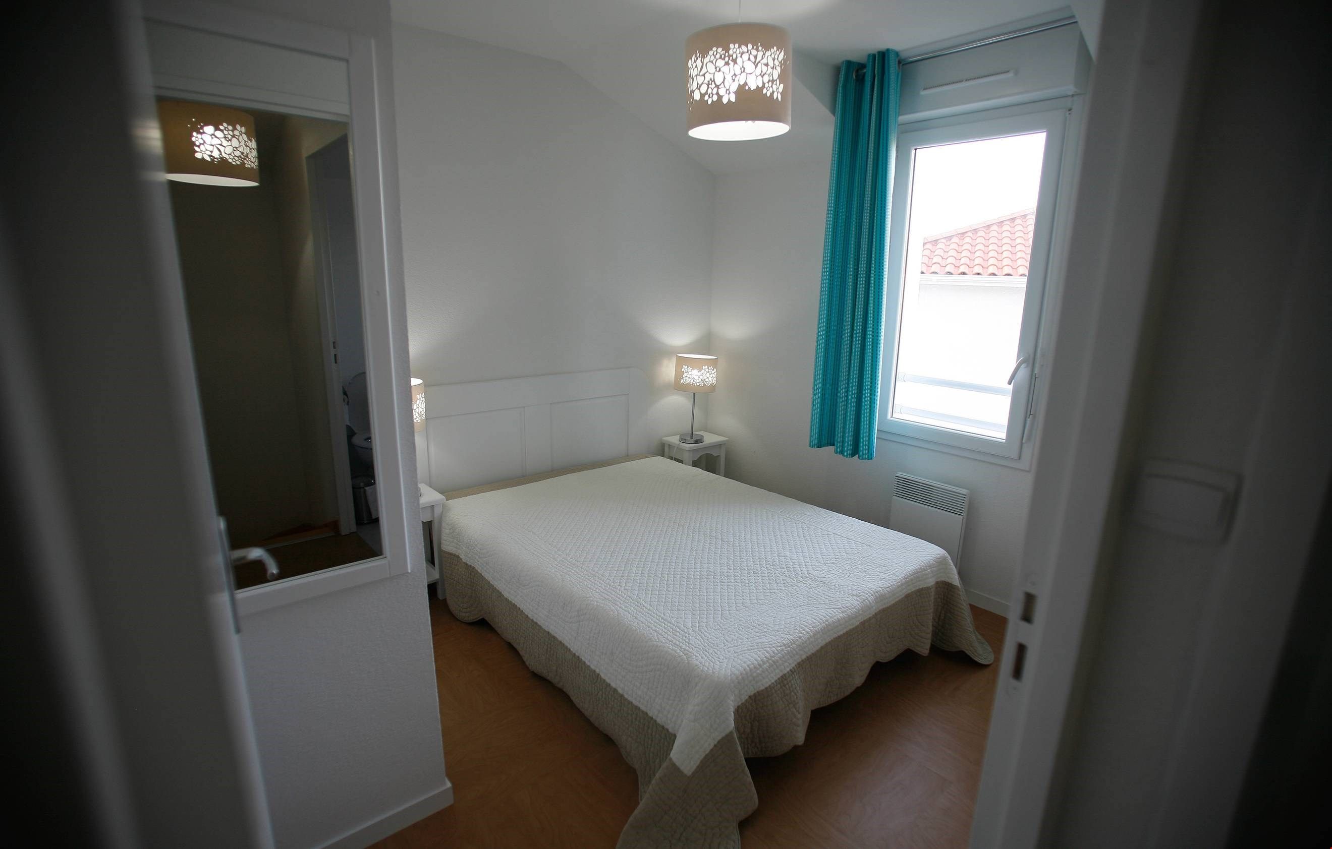image Drift off to sleep in the comfortable double bed for 2. Bedding configurations may vary.