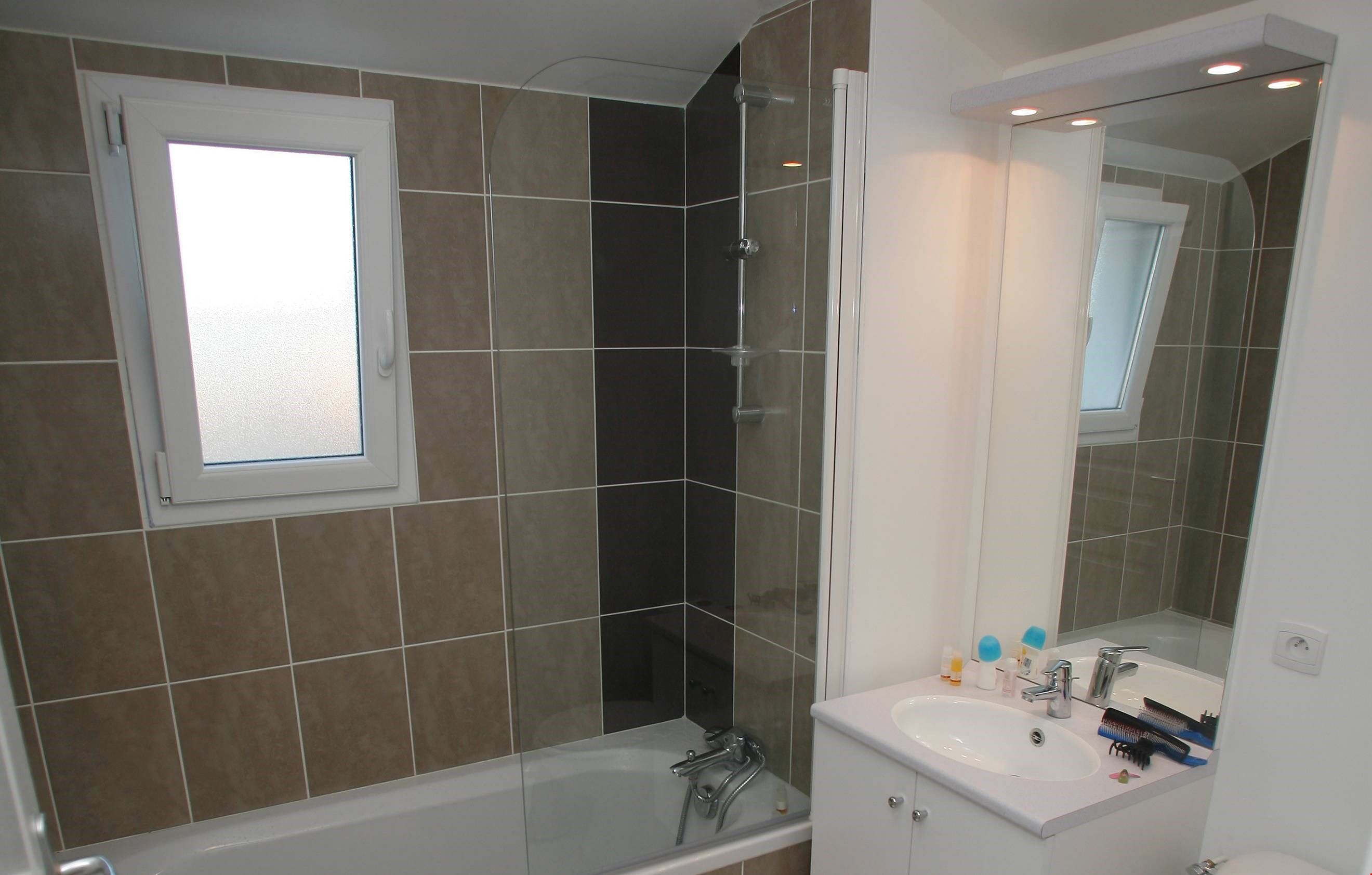 image Prepare for your day outside in the spacious bathroom.