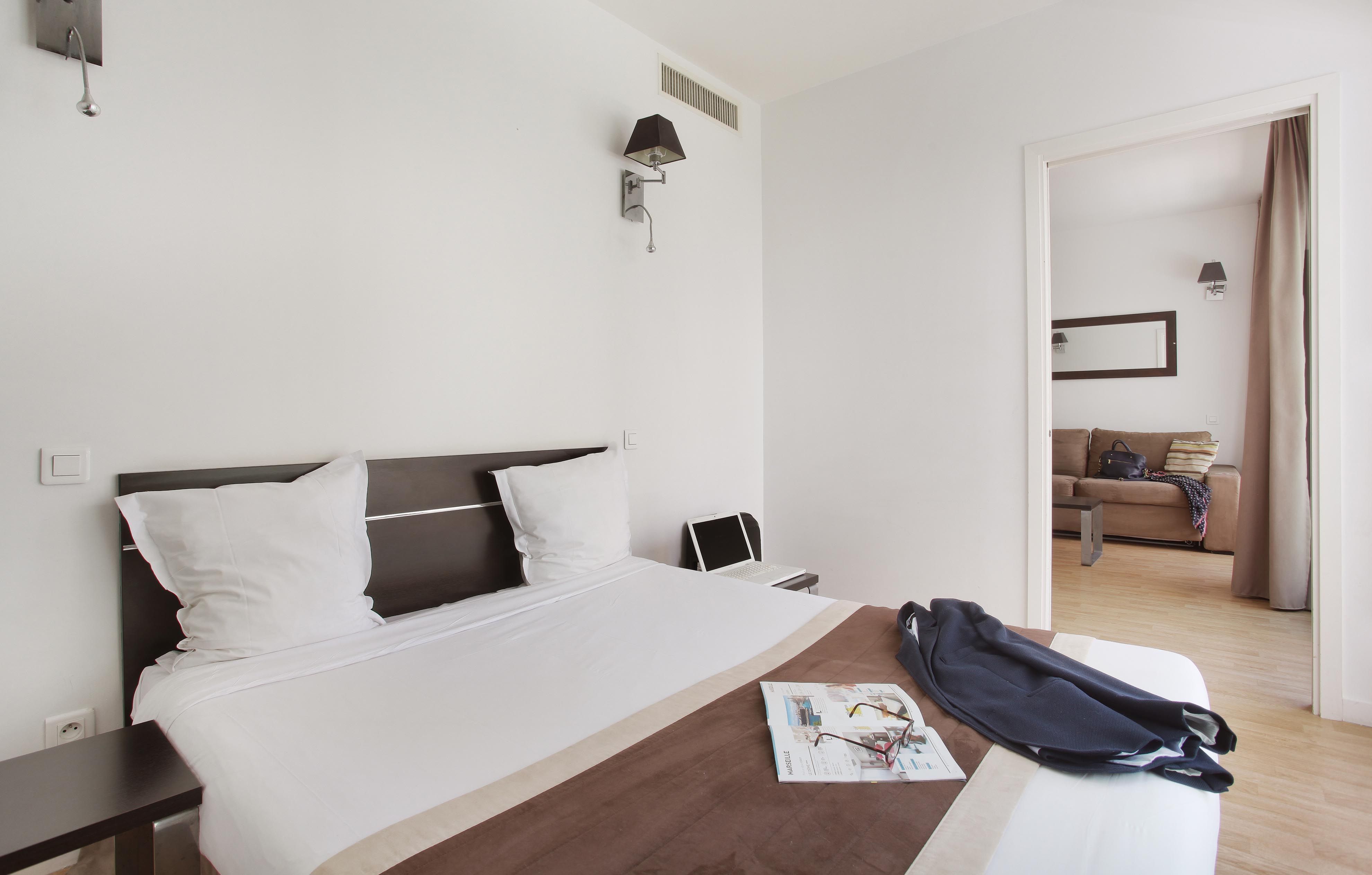 image Comfortable double bed in the private bedroom, offering a quiet retreat within the city-style apartment.