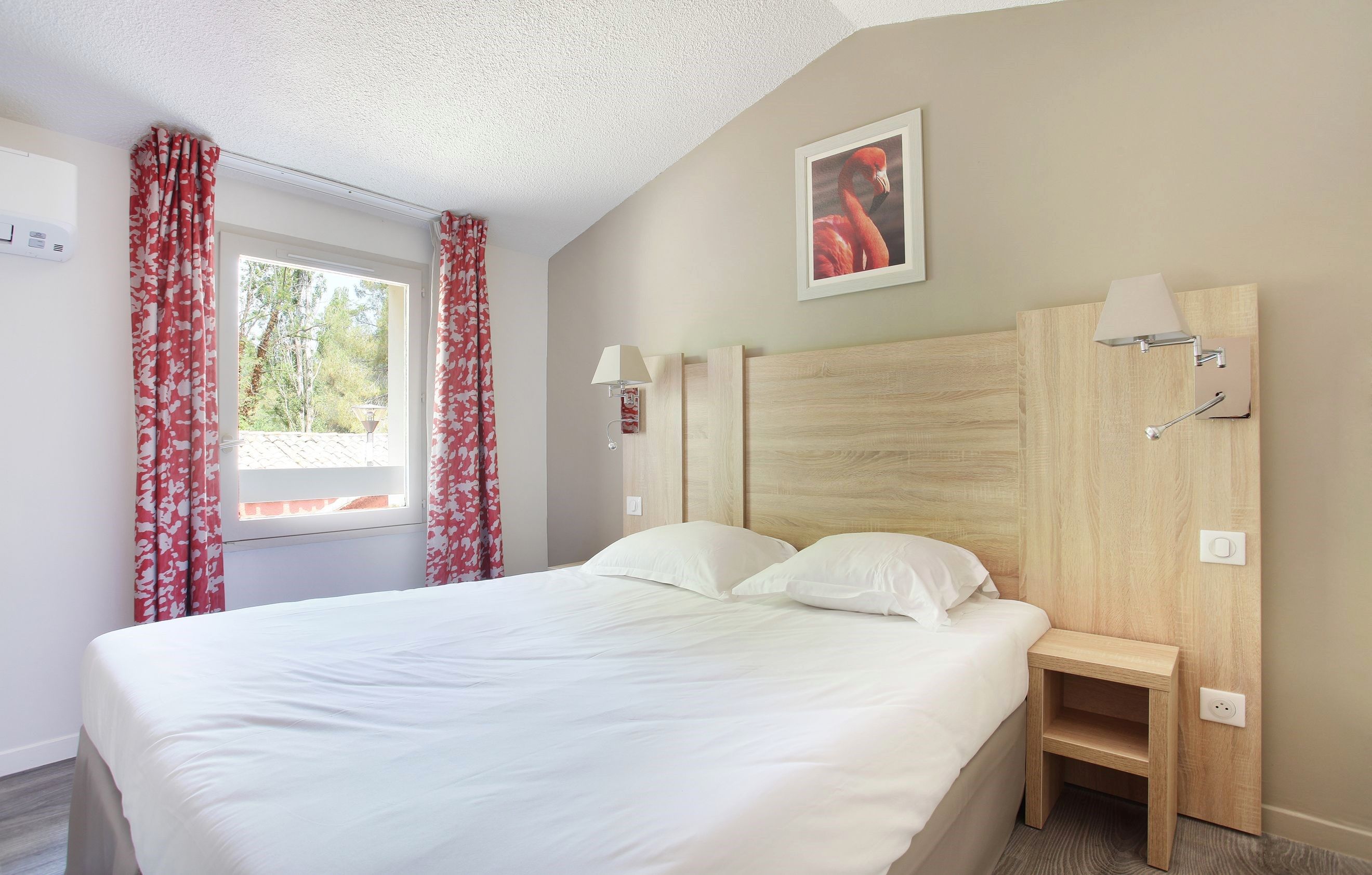 image Drift to sleep in a comfortable bed after a wonderful day outside. Bedding configurations vary.