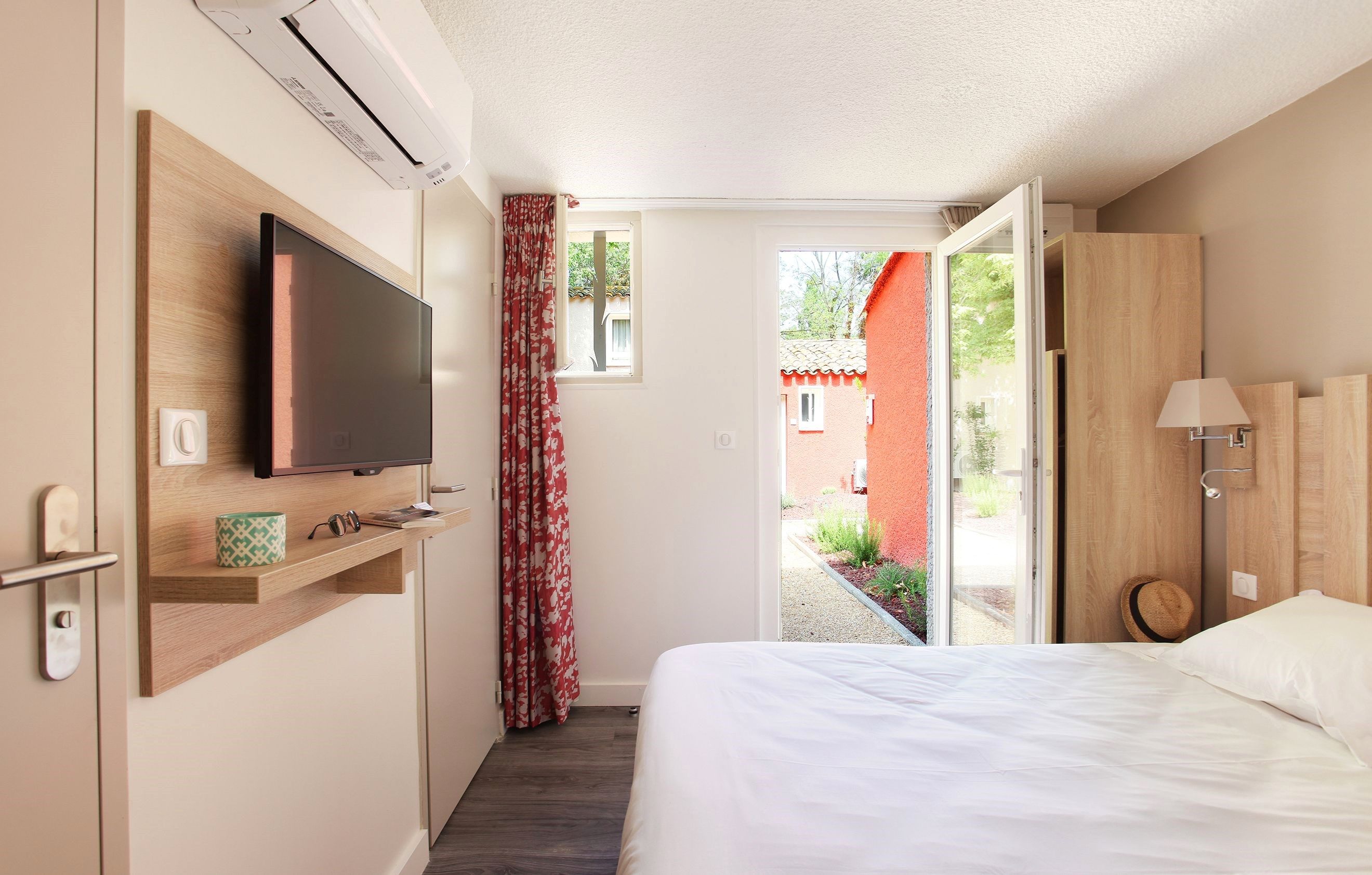 image Relax on the comfy bed after a day outside. Bedding configurations vary.