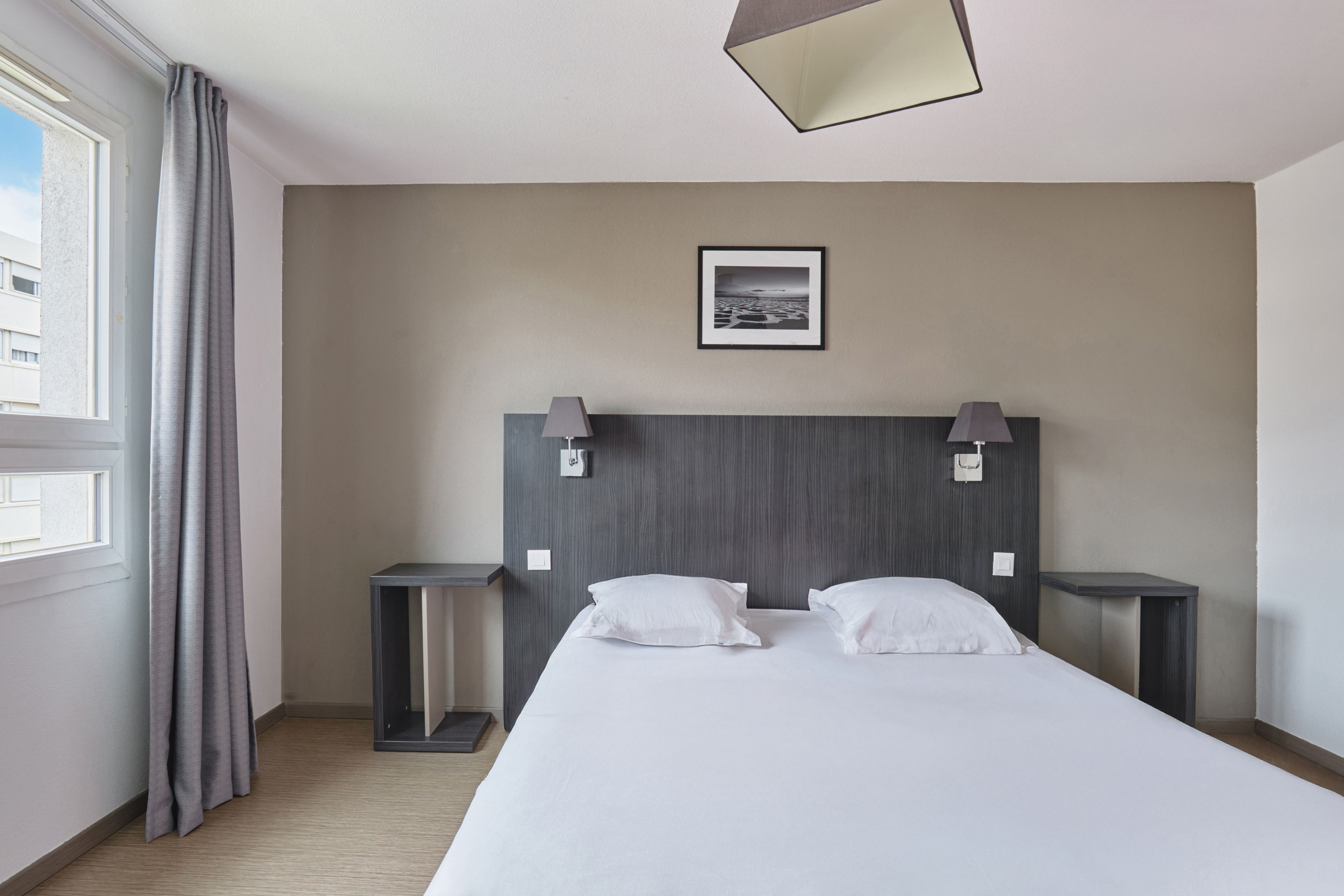 image Peaceful bedroom with minimalist decor and soft lighting offering a relaxing retreat for restful nights.