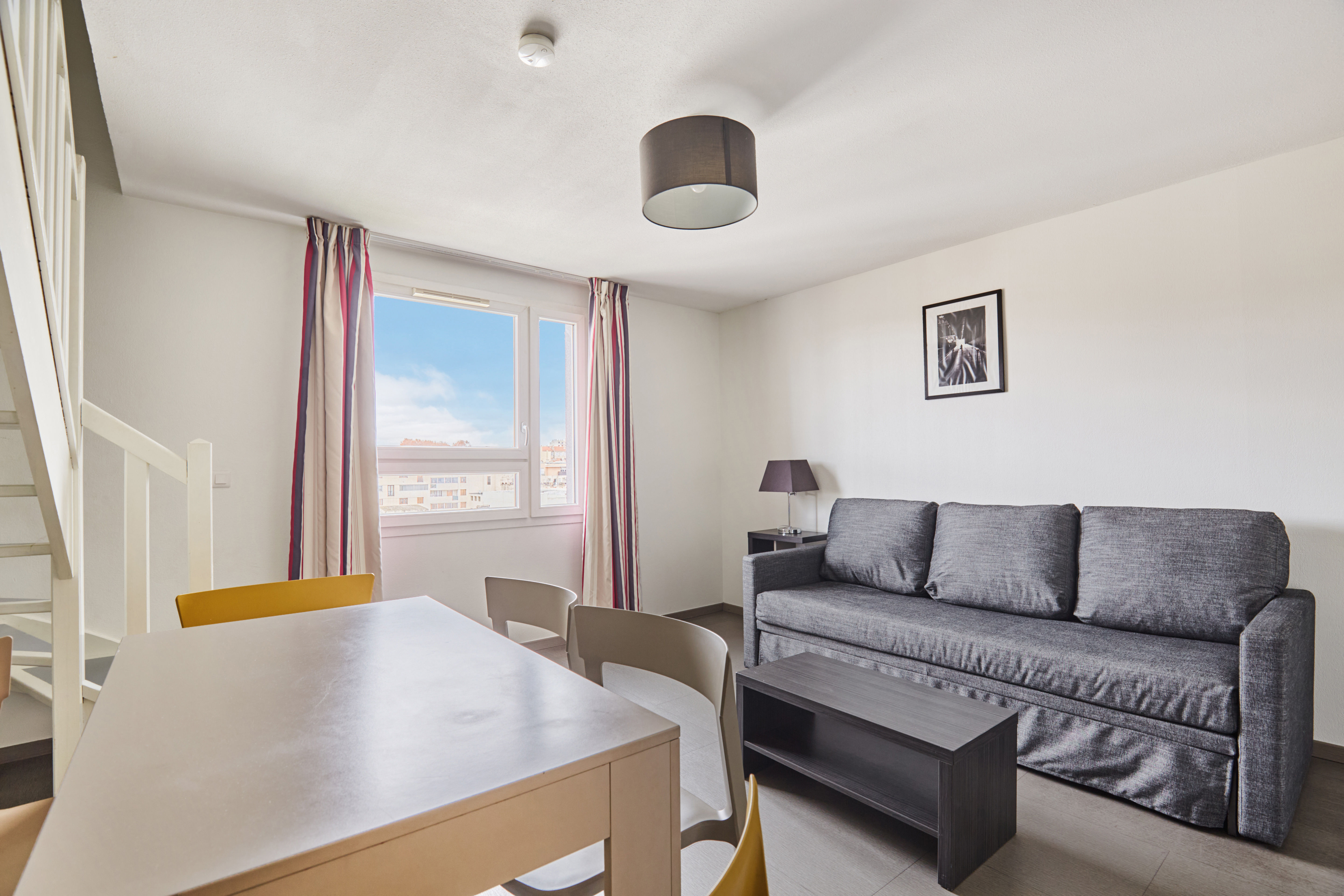 image Bright and airy living space blending comfort and practicality for a relaxing family stay.