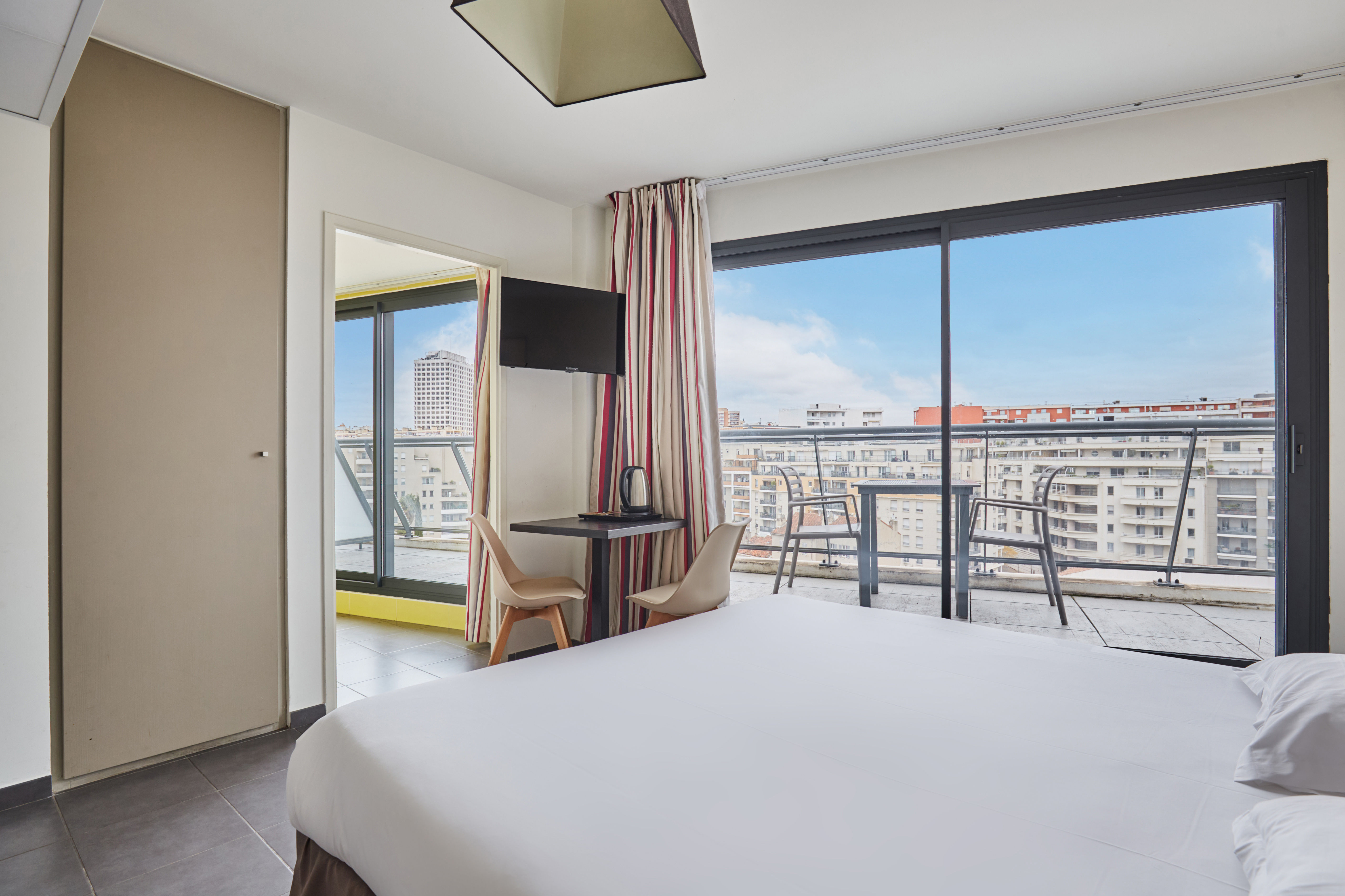 image Elegant décor and bright ambiance with doors opening to Marseille’s fresh air. Balconies are available in select units—requests are welcome and subject to availability.
