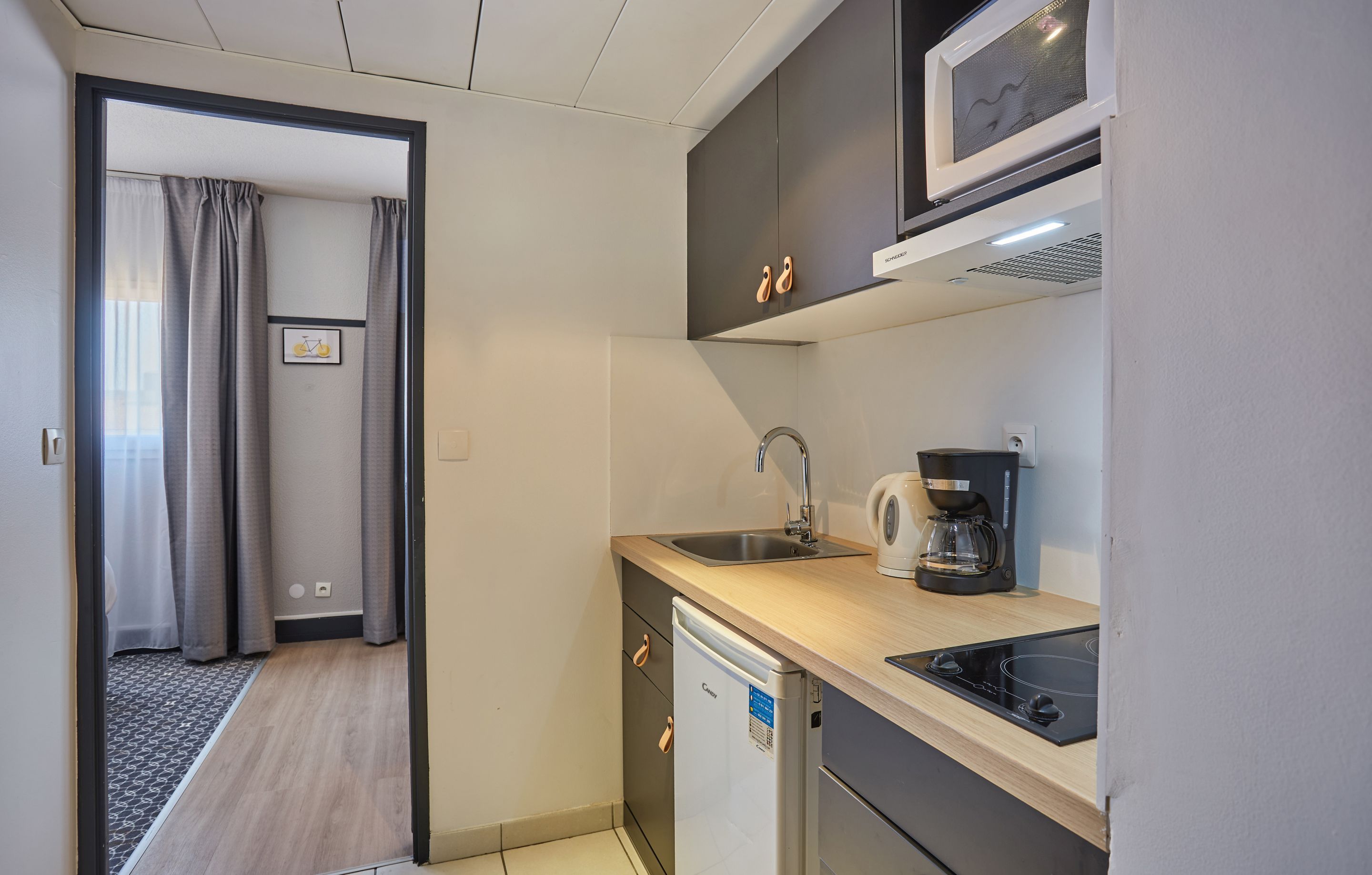 image Prepare a small meal in your kitchenette (please note that there is no dishwasher).