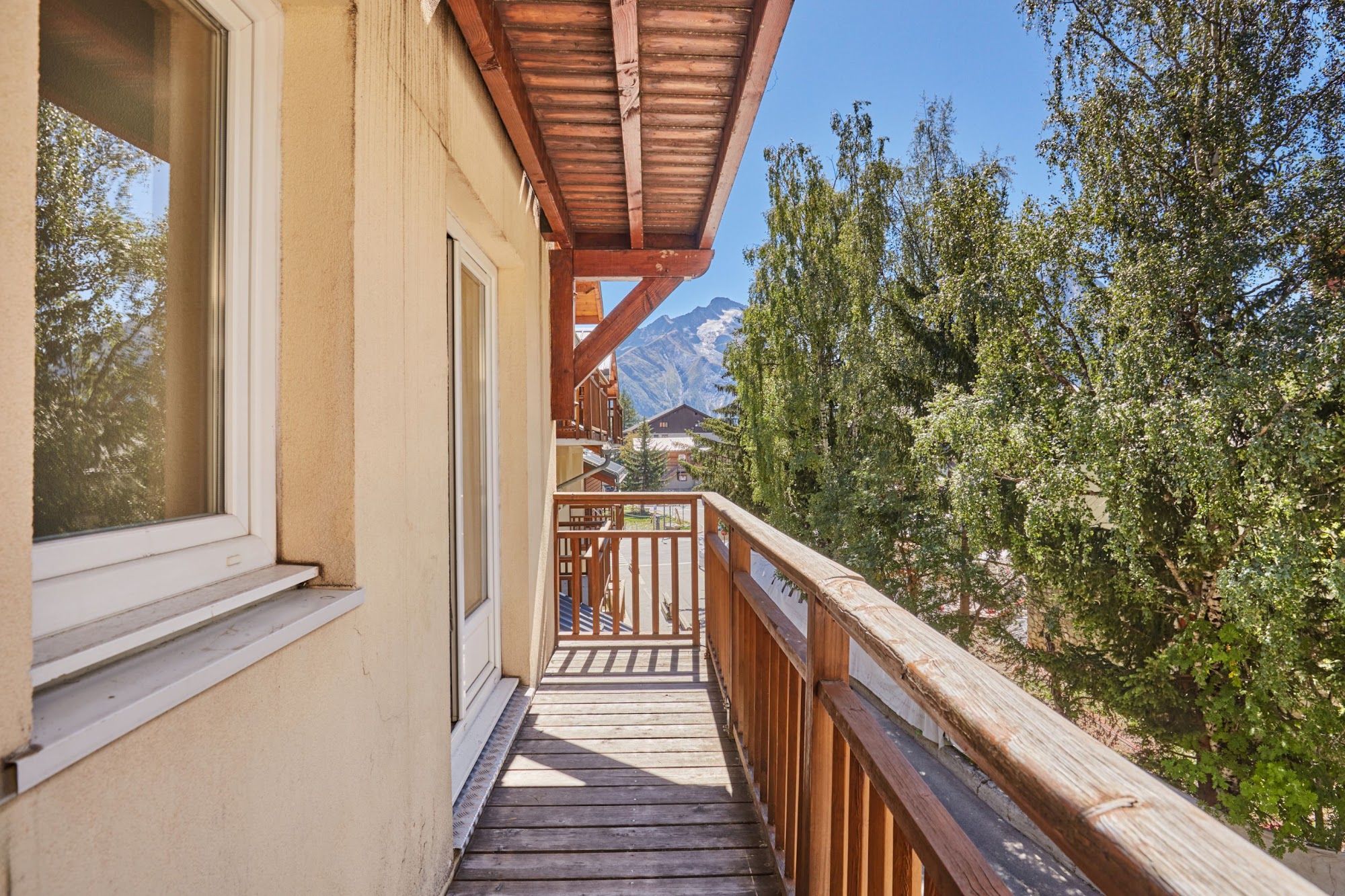 image Balcony view over trees towards a mountain