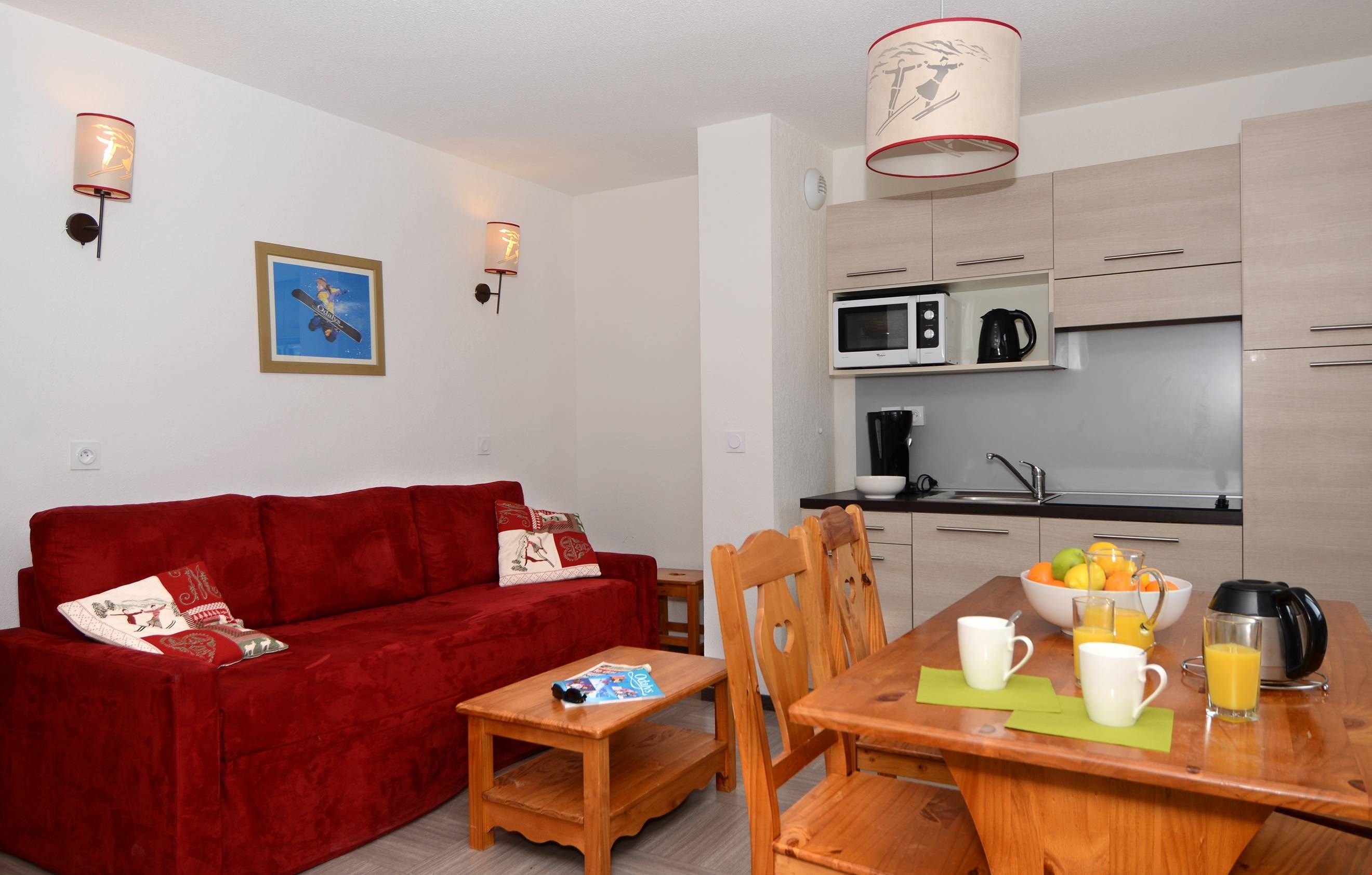 image Relax in the open-concept living space which adjoins with the fitted kitchenette.