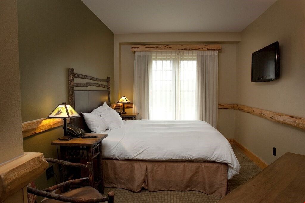 image Drift off to sleep in the plush double bed. Bedding configurations may vary