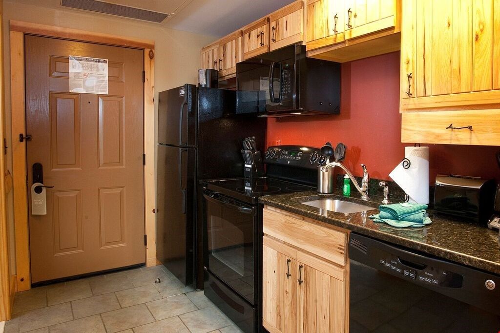 image Prepare home cooked meals for your group to enjoy in the fitted kitchen