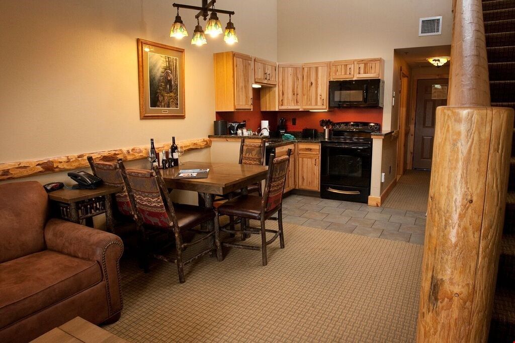 image Relax in the gorgeous open-concept living space and enjoy a game of cards or meal at the dining table