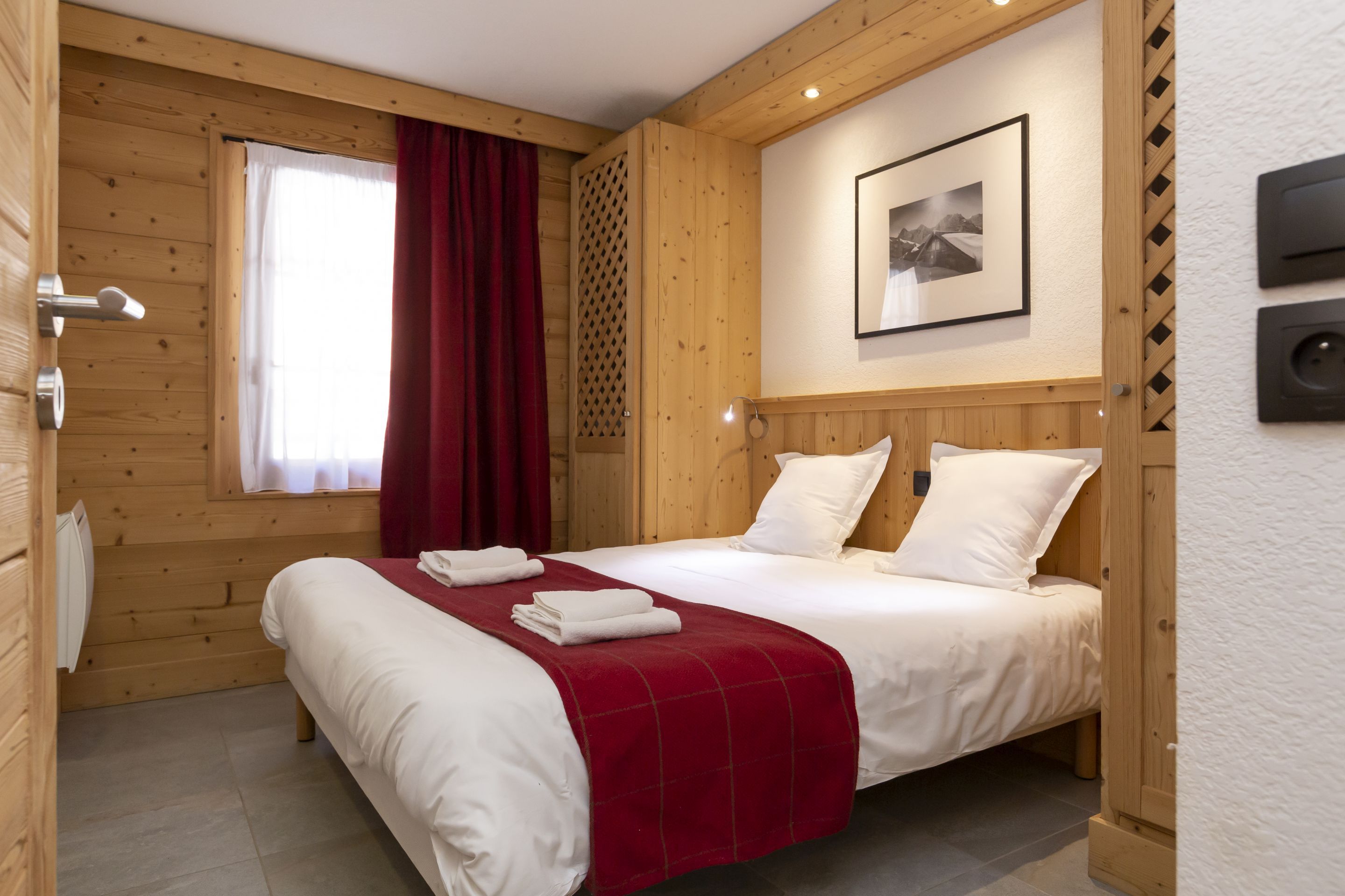 image The bedroom features cosy Alpine-style furnishings and warm linens made up on arrival, so you can go straight from the gondola to bed.