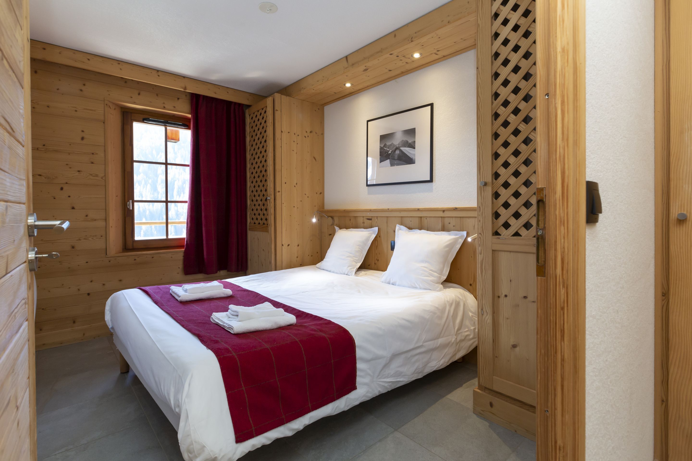 image The double bedroom with warm linens made up on arrival — one less thing to think about after a long day on the Portes du Soleil.