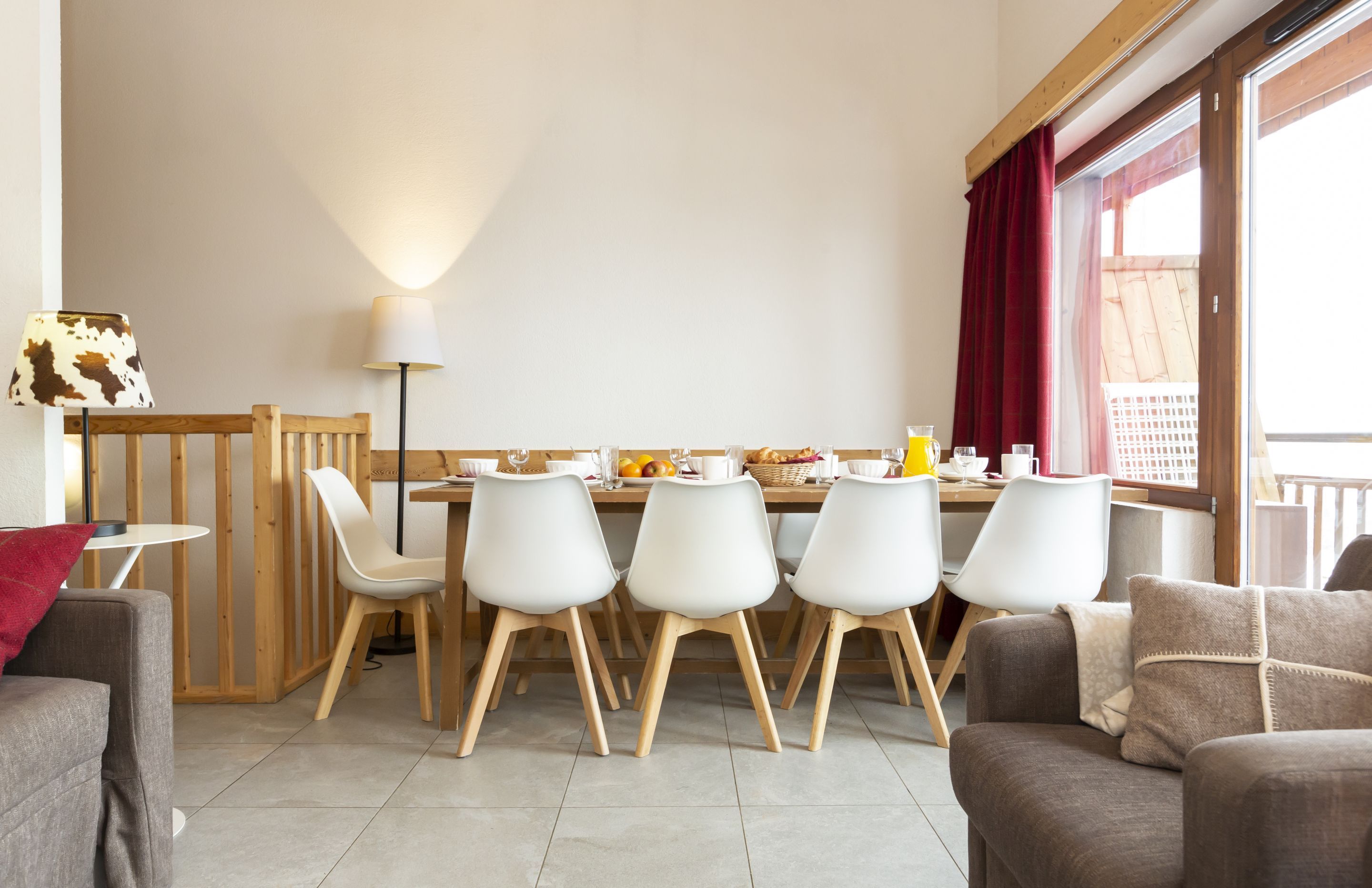 image The large dining table at the heart of the duplex — generous enough for the whole group to gather after a day across the Portes du Soleil.