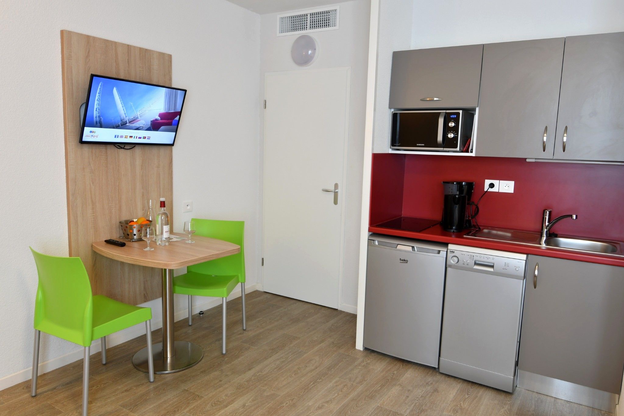image Make a quick meal in your kitchen while watching a show on television.