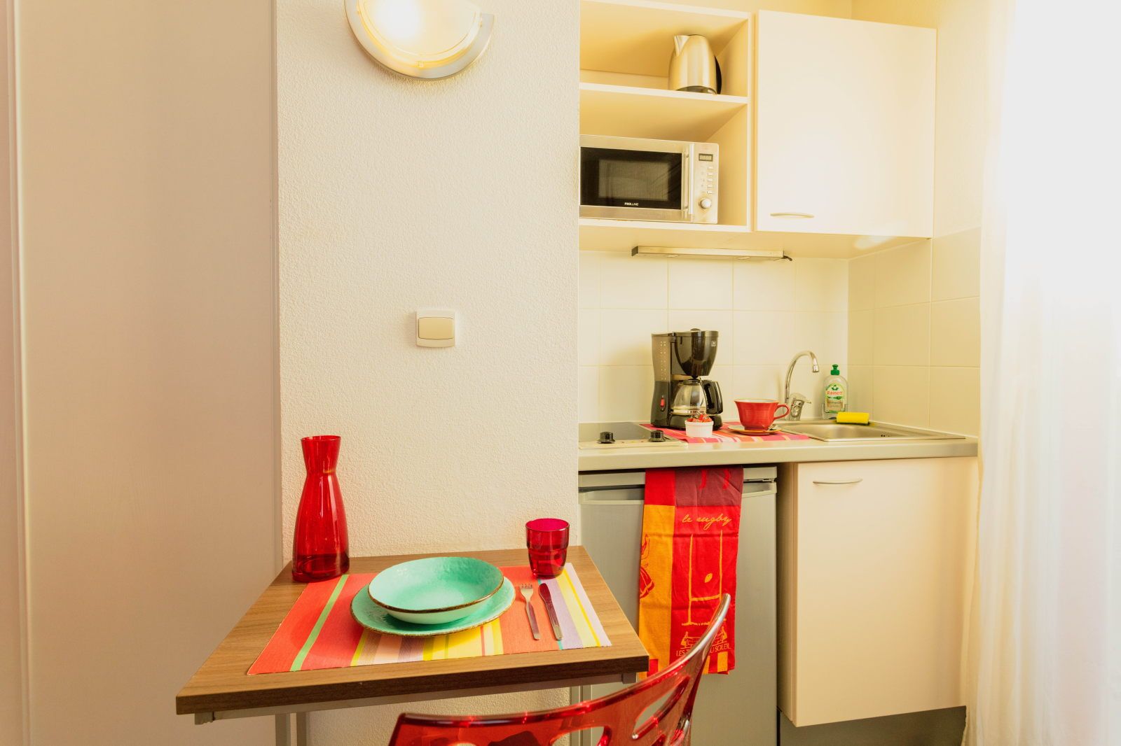 image A kitchen corner — coffee, meals, and a cozy seat, all included