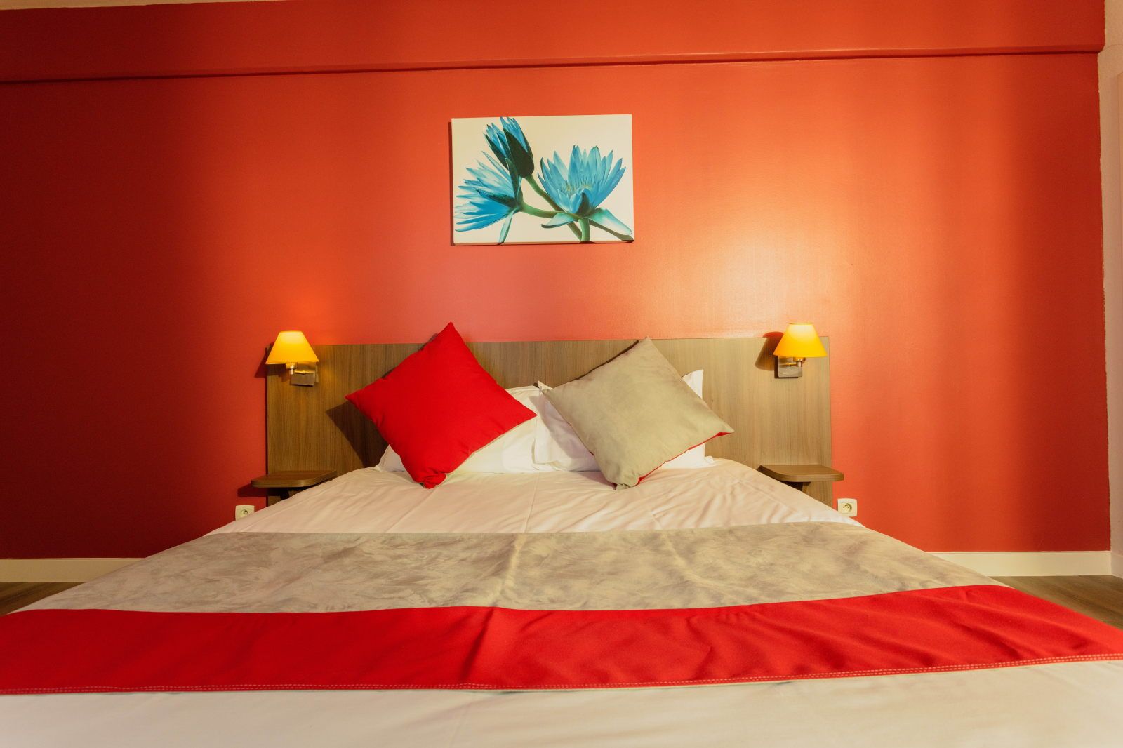 image Close-up of the bed with two pillows and a wall art piece above