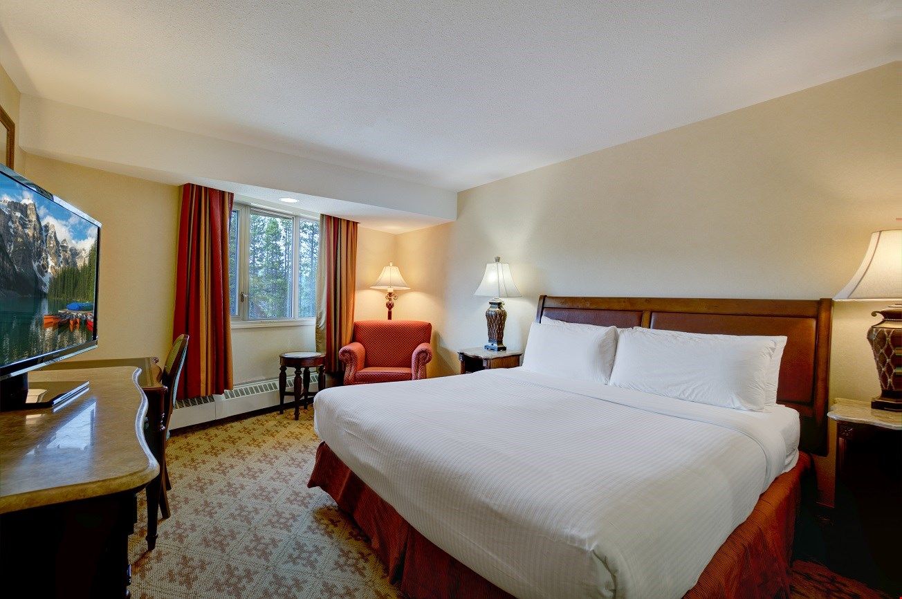 image The Deluxe King Hotel Room features a luxurious king bed