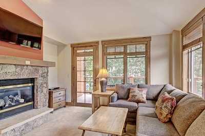 Kick back your feet and relax in the spacious, bright living room.