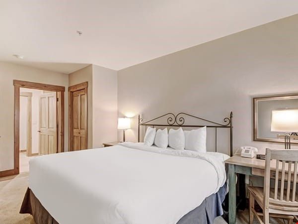 image Sink into the plush king sized bed in the master bedroom.