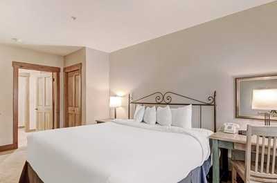 Sink into the plush king sized bed in the master bedroom.