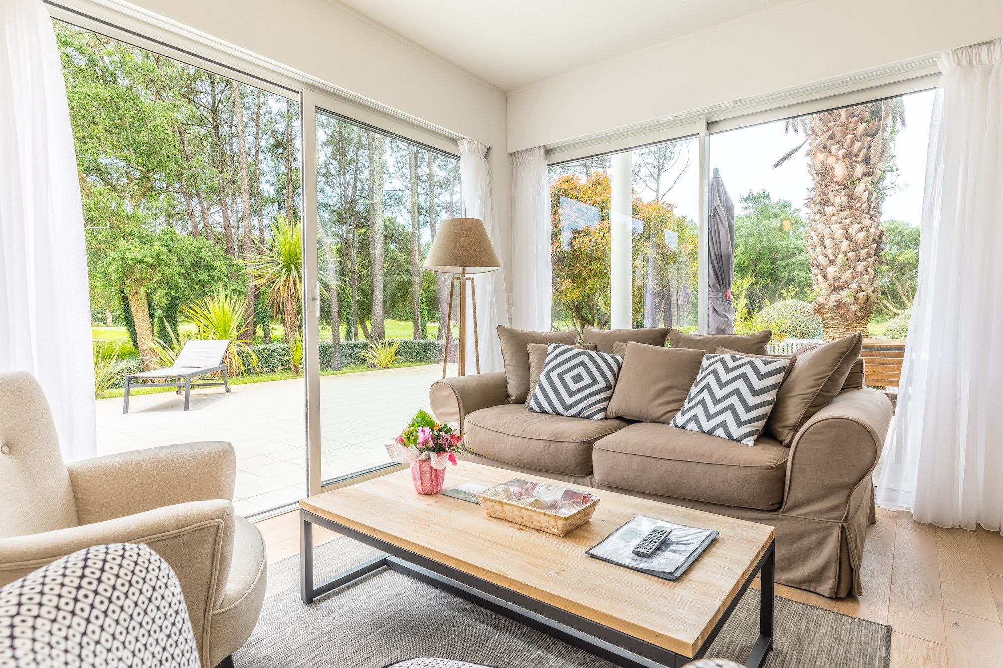 image Relax in the cozy living area with large windows and A/C.