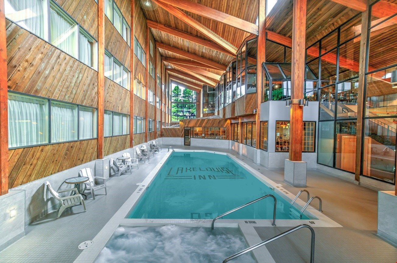 image A serene indoor pool area with stunning wooden architecture, perfect for a relaxing swim or soak.