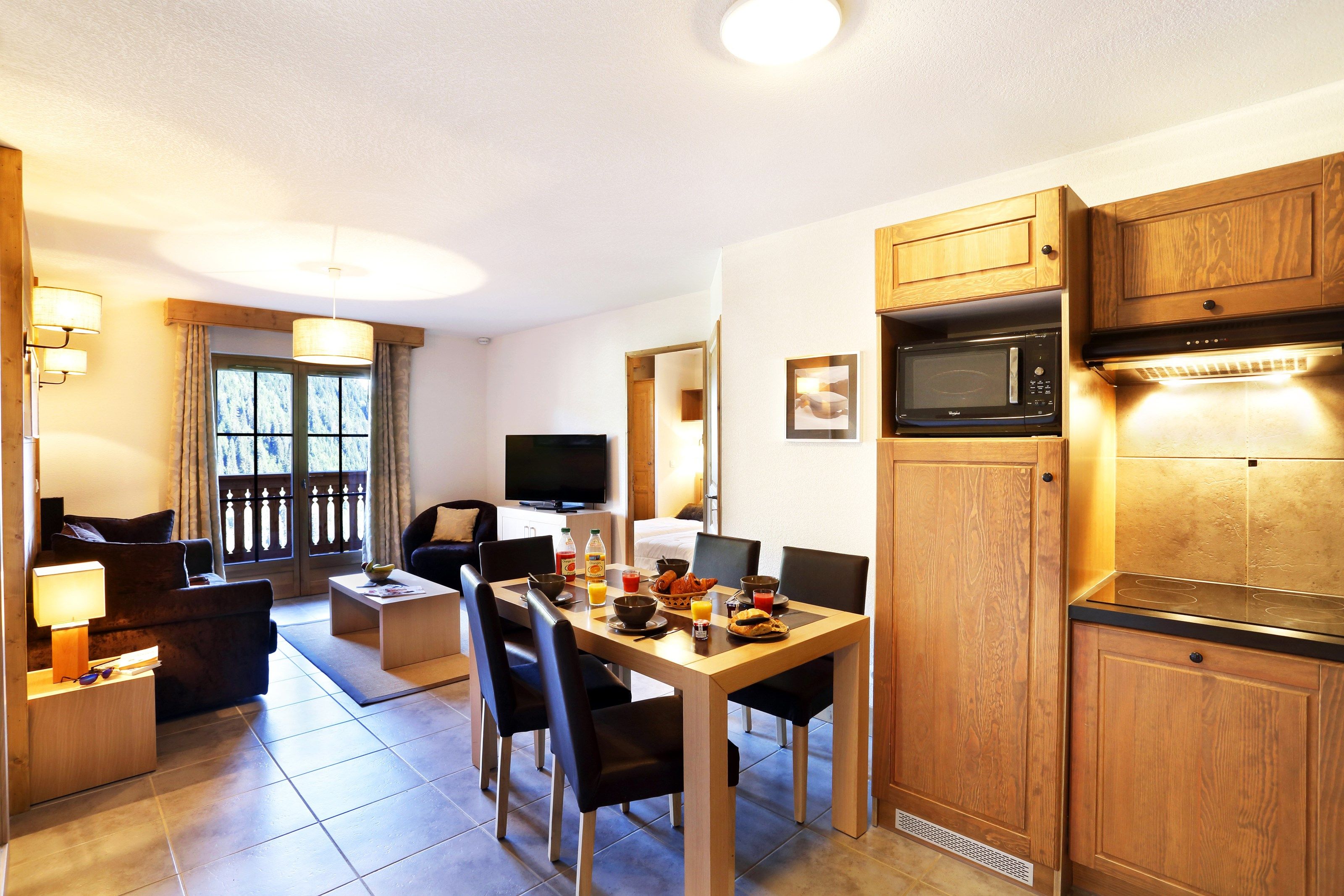image Prepare meals in the equipped kitchenette and enjoy your food at the dining table.
