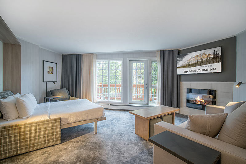 image A spacious and inviting living room with cozy furnishings and a touch of natural charm, ideal for unwinding after a long day.