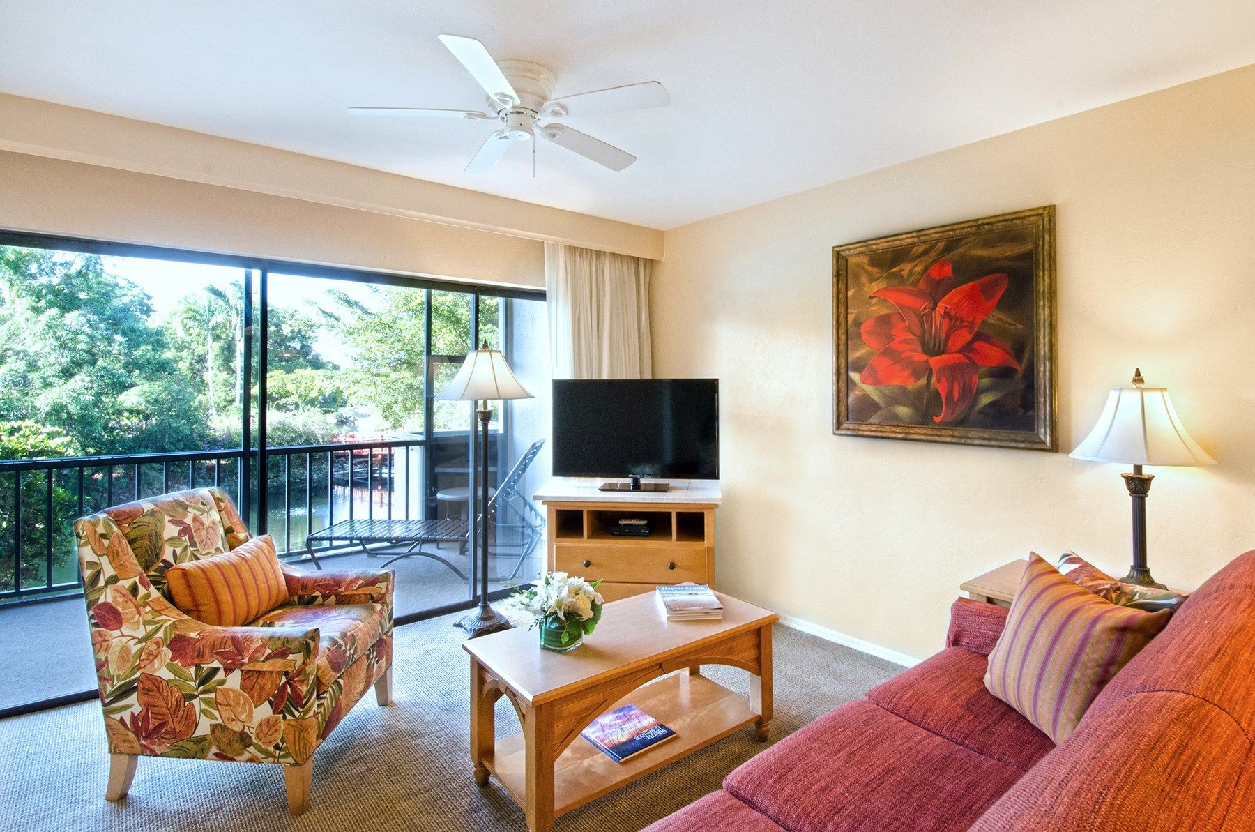 image Find peace and relaxation with your close friends and family in this stunning living room featuring natural decor.