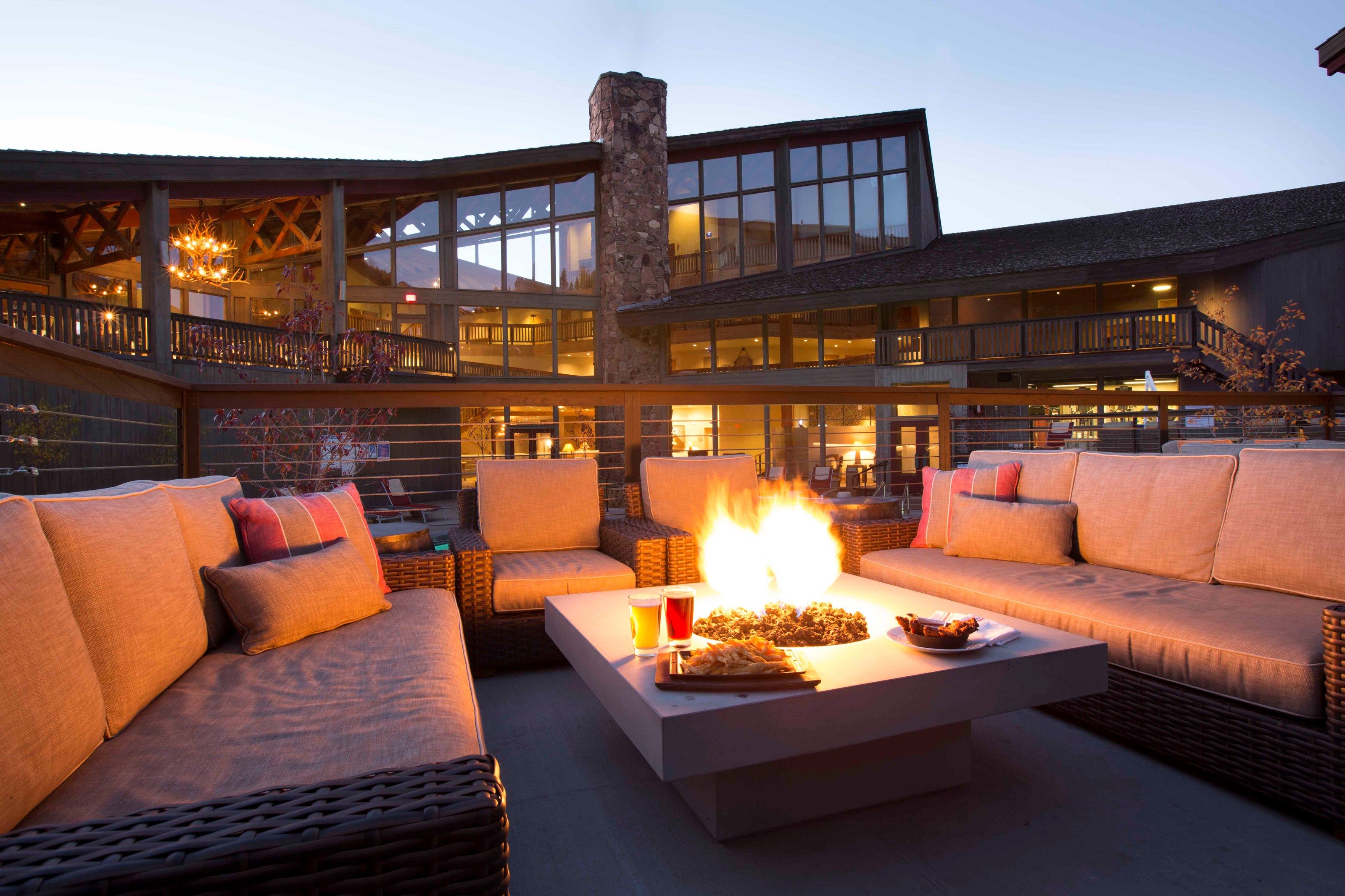image Unwind by the fire in this stylish outdoor lounge, the perfect spot to enjoy a crisp evening under the stars.