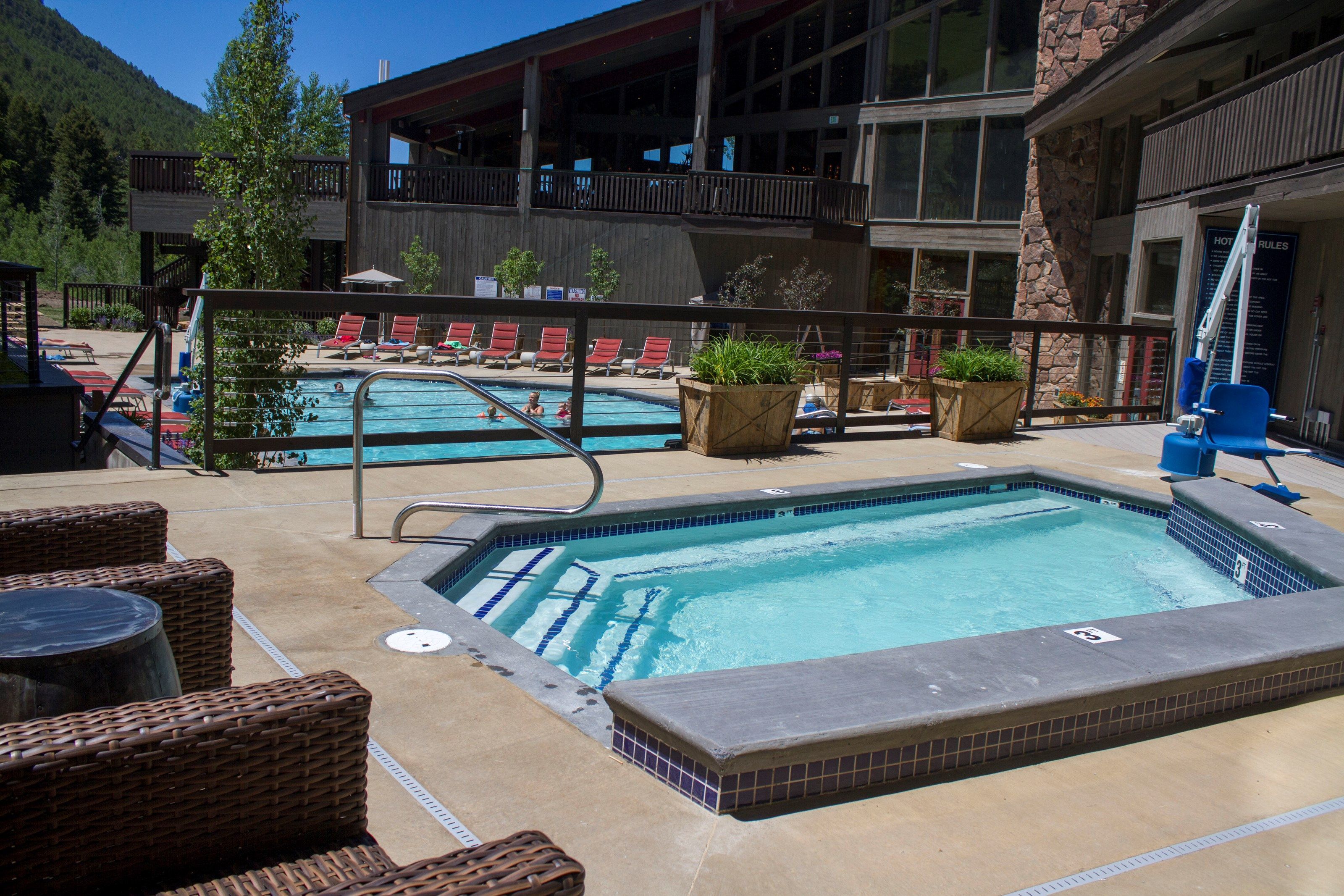 image Soak in the peaceful atmosphere of this inviting outdoor spa, perfect for relaxation and rejuvenation.