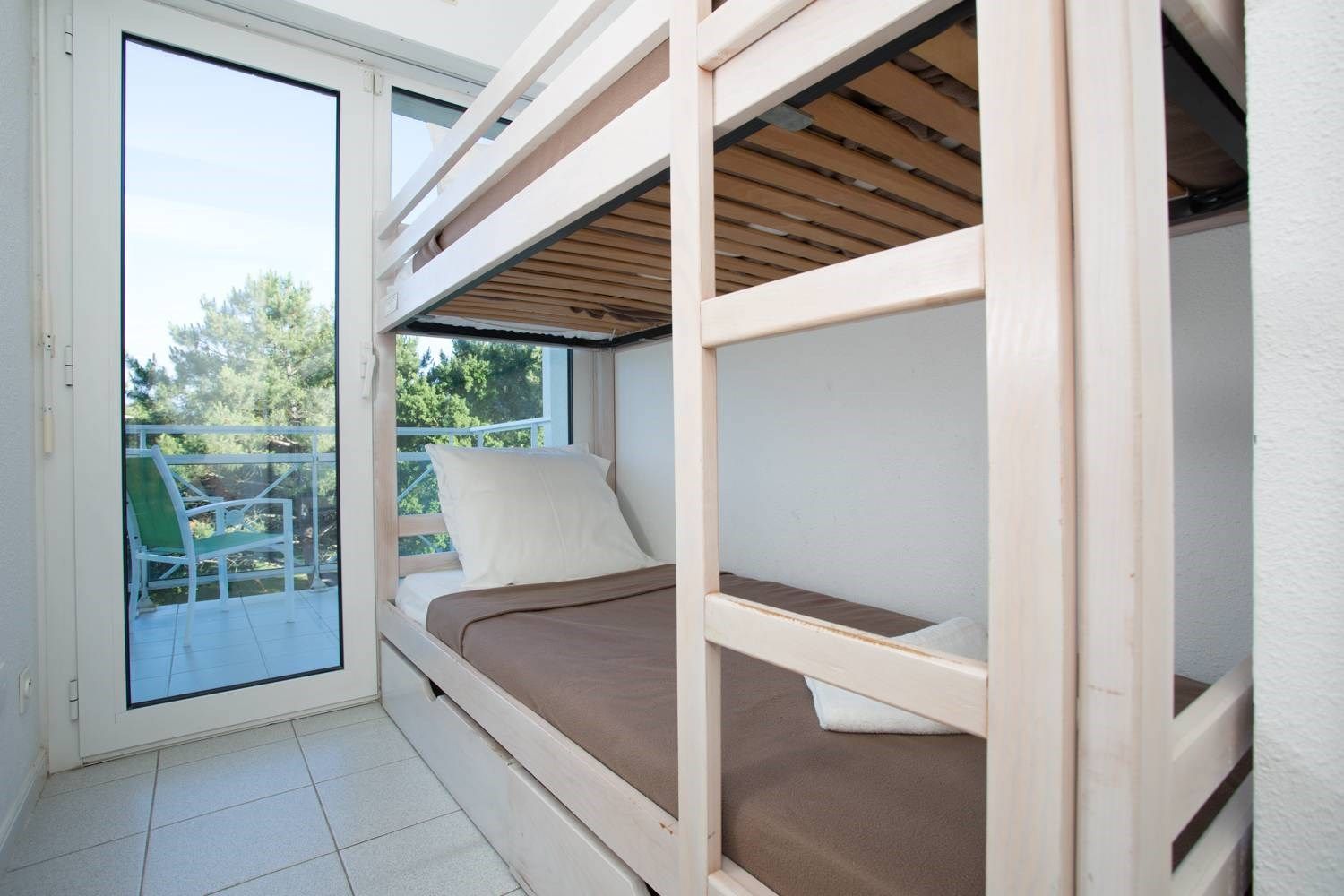 image The sleeping alcove contains a cozy Bunk bed.