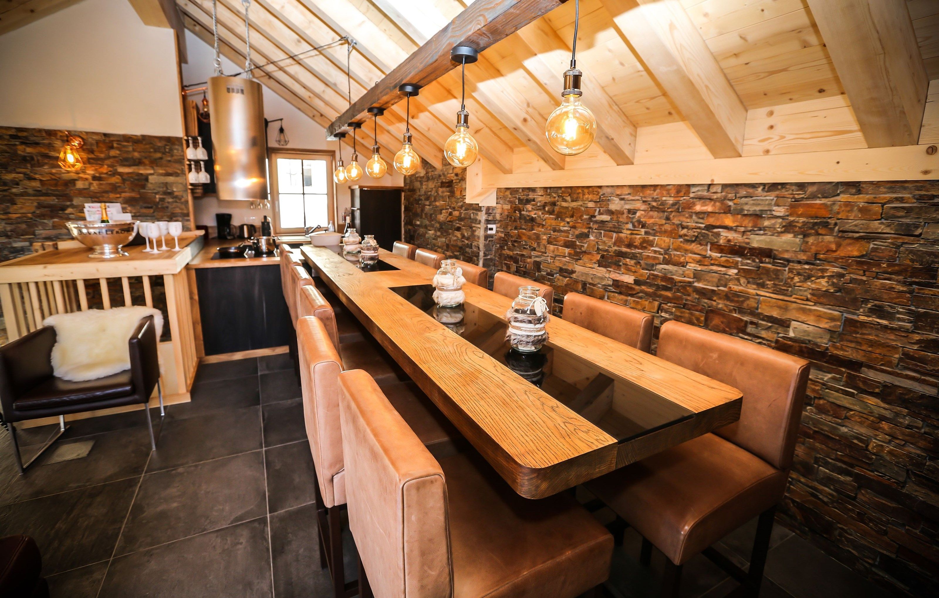 image The ground floor is open and cozy, featuring a sitting area, dining area, and kitchen.