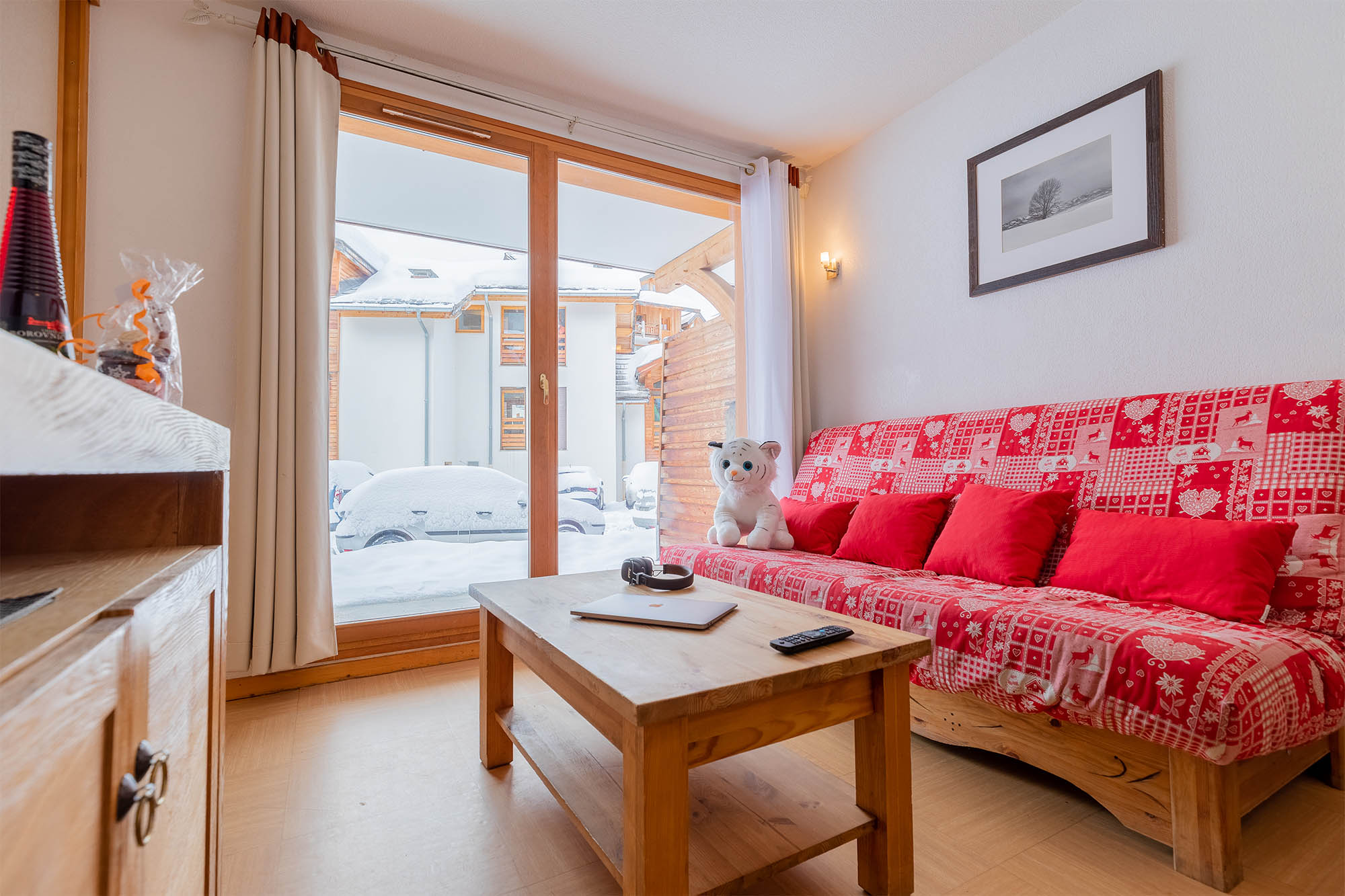 image Living area with window view of snow outside