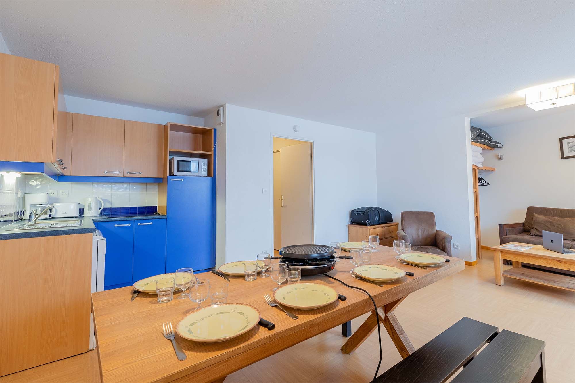 image Kitchen area with microwave and dining table