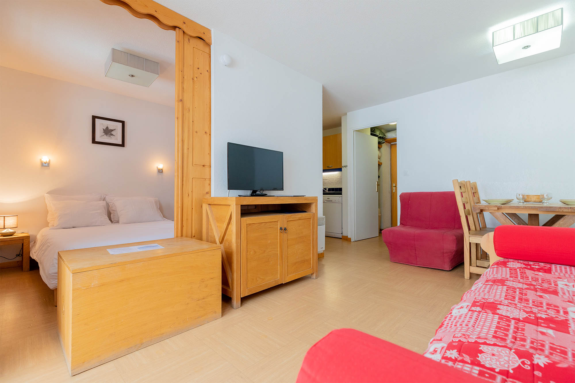 image Living space with a double bed and a sofa bed