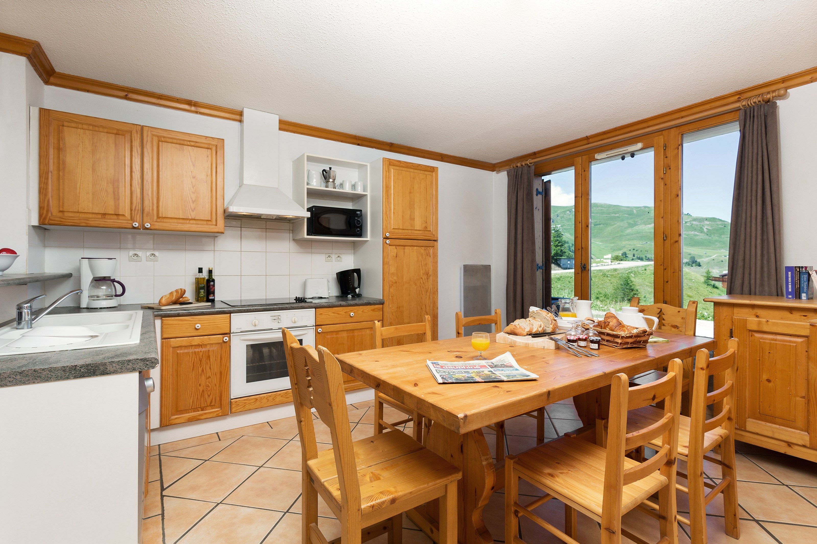 image Enjoy the fully-equipped kitchen and grand dining table.