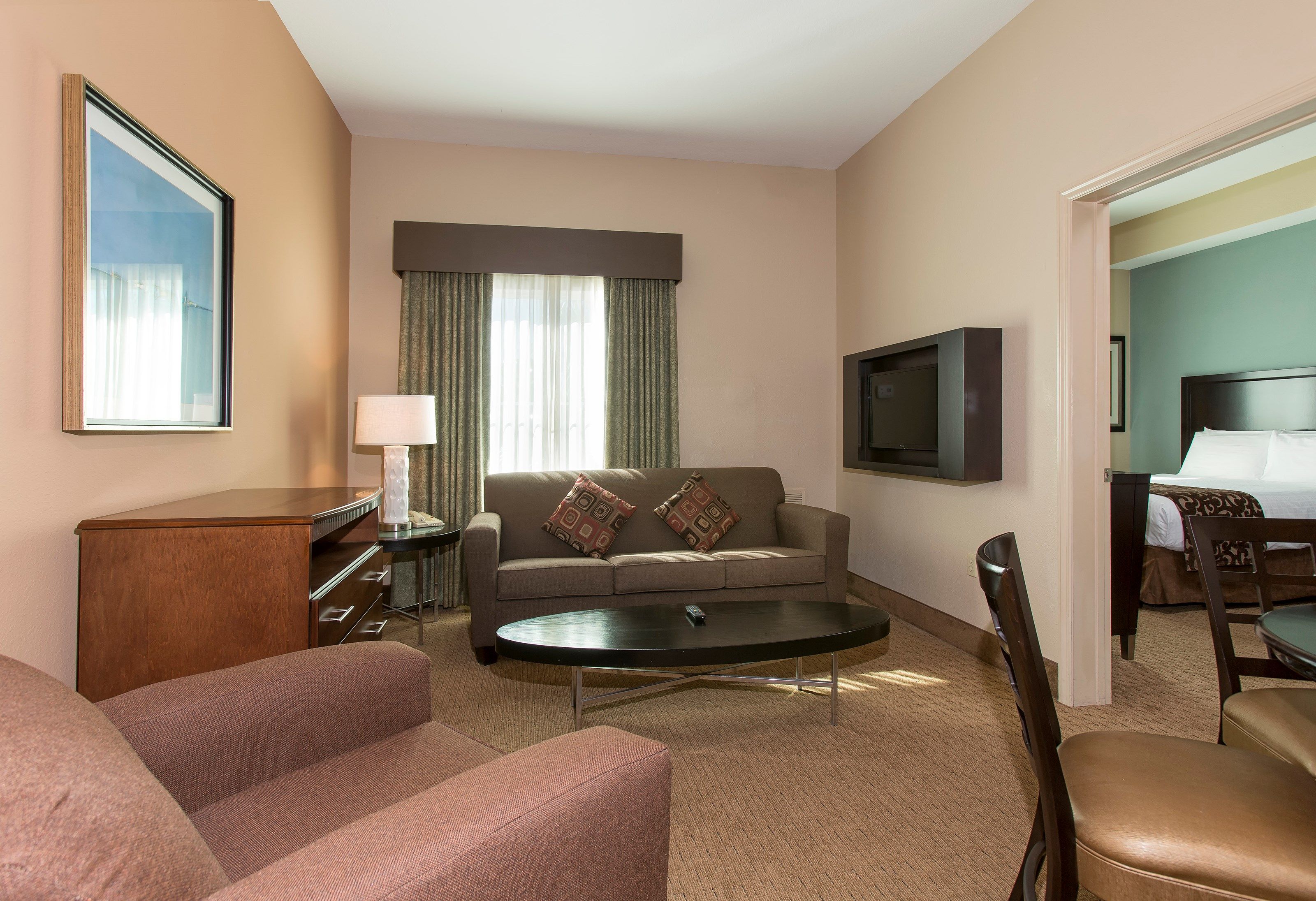 image Relax on the sofa in our cozy and inviting suite after a day in the sun.