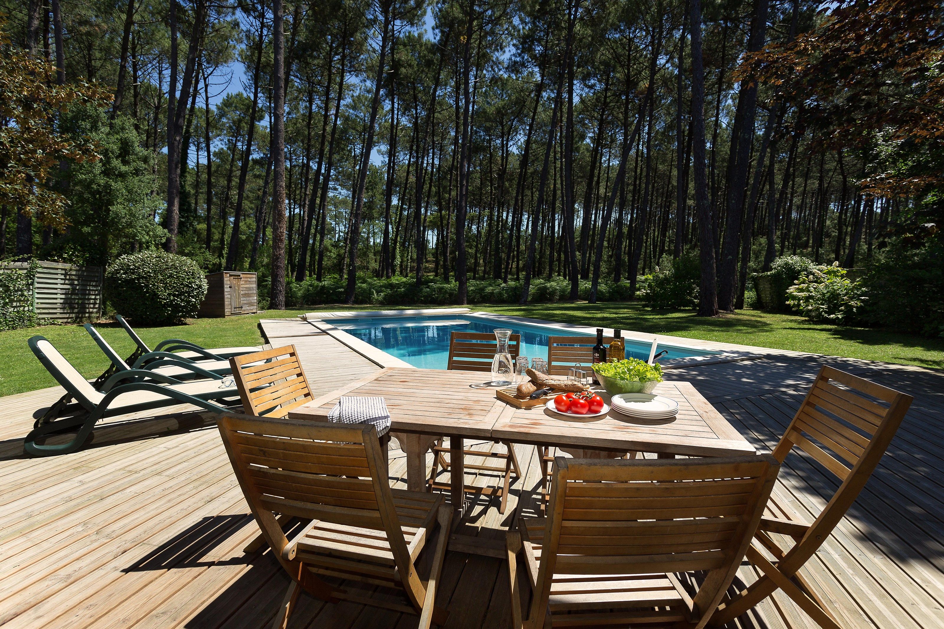 image Enjoy reminiscing about your day while sipping a glass of wine by your private pool.