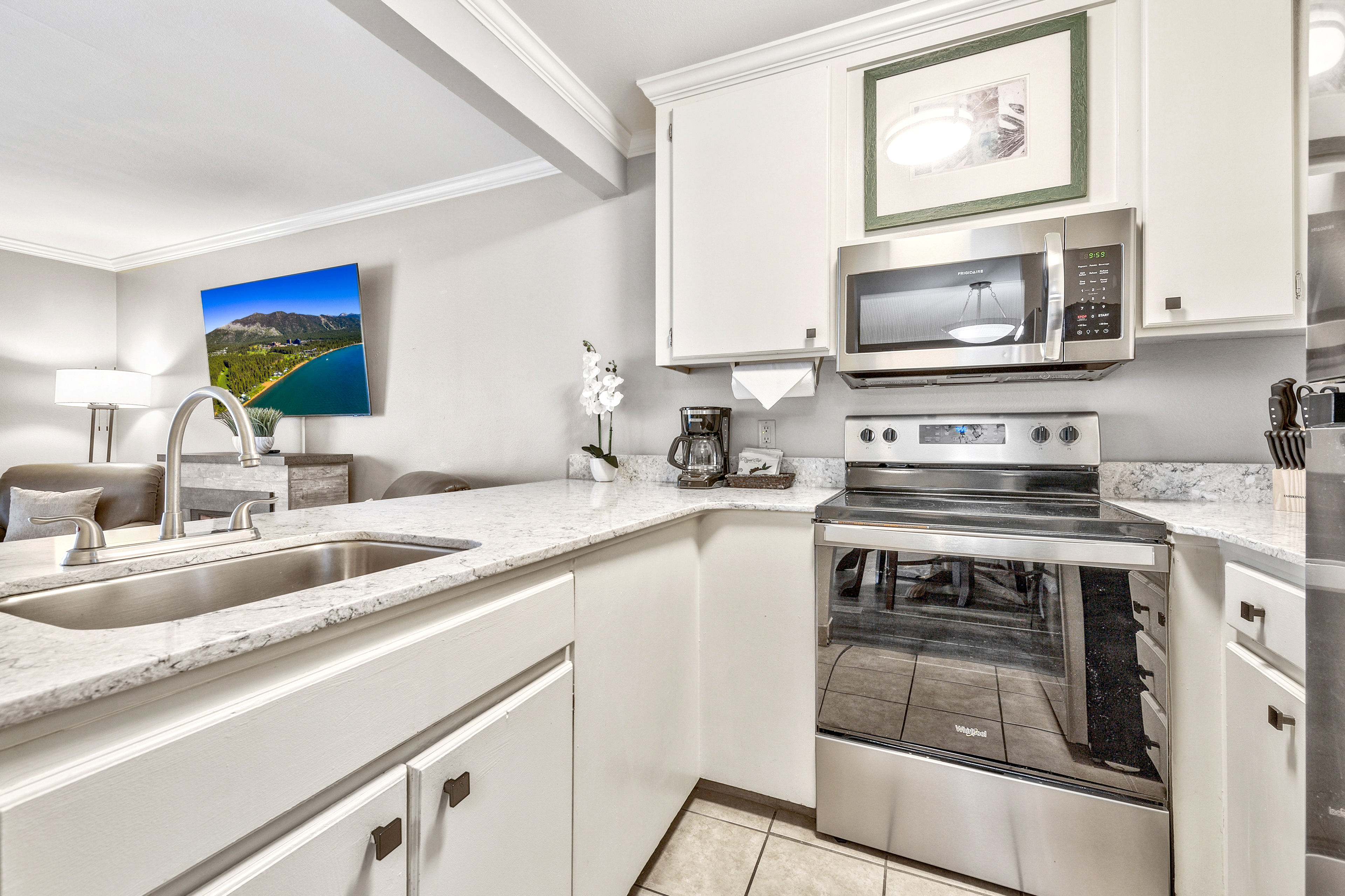 image A bright and functional kitchen with modern touches, offering the perfect space to prepare delicious meals in a home-like setting.