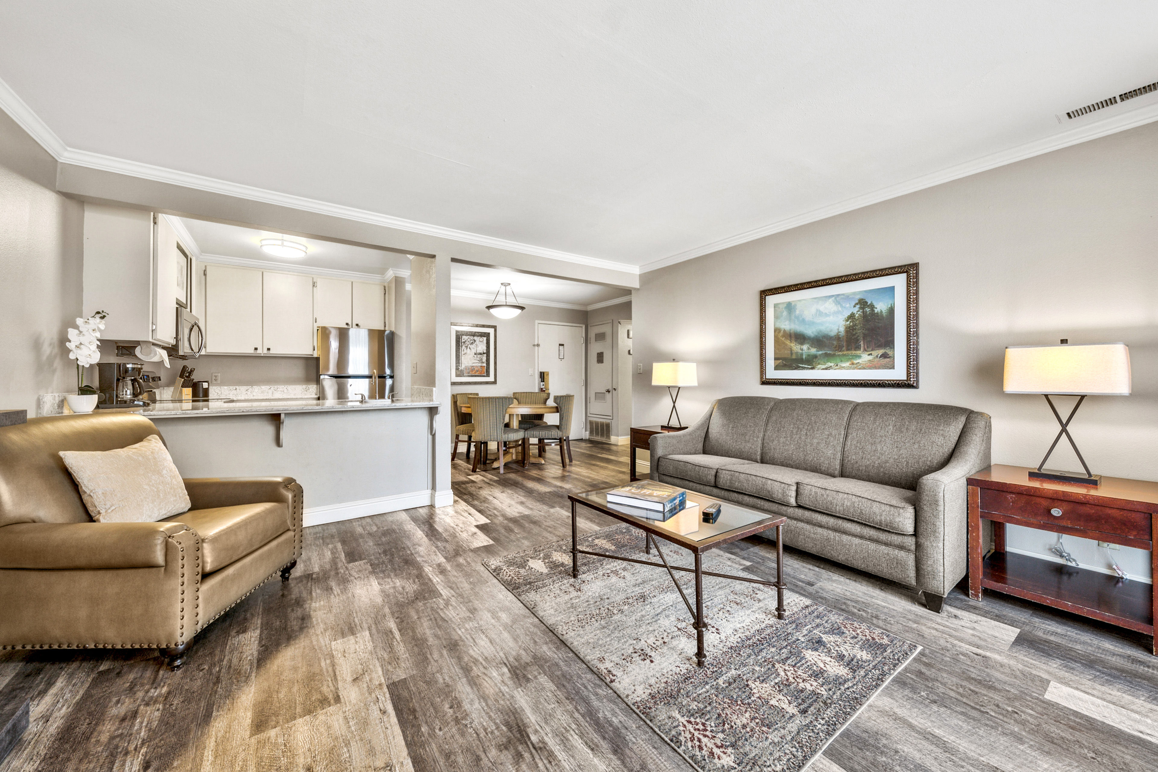 image Spacious and elegantly designed, this open-concept living area blends comfort and style, creating the perfect setting for gathering and unwinding.