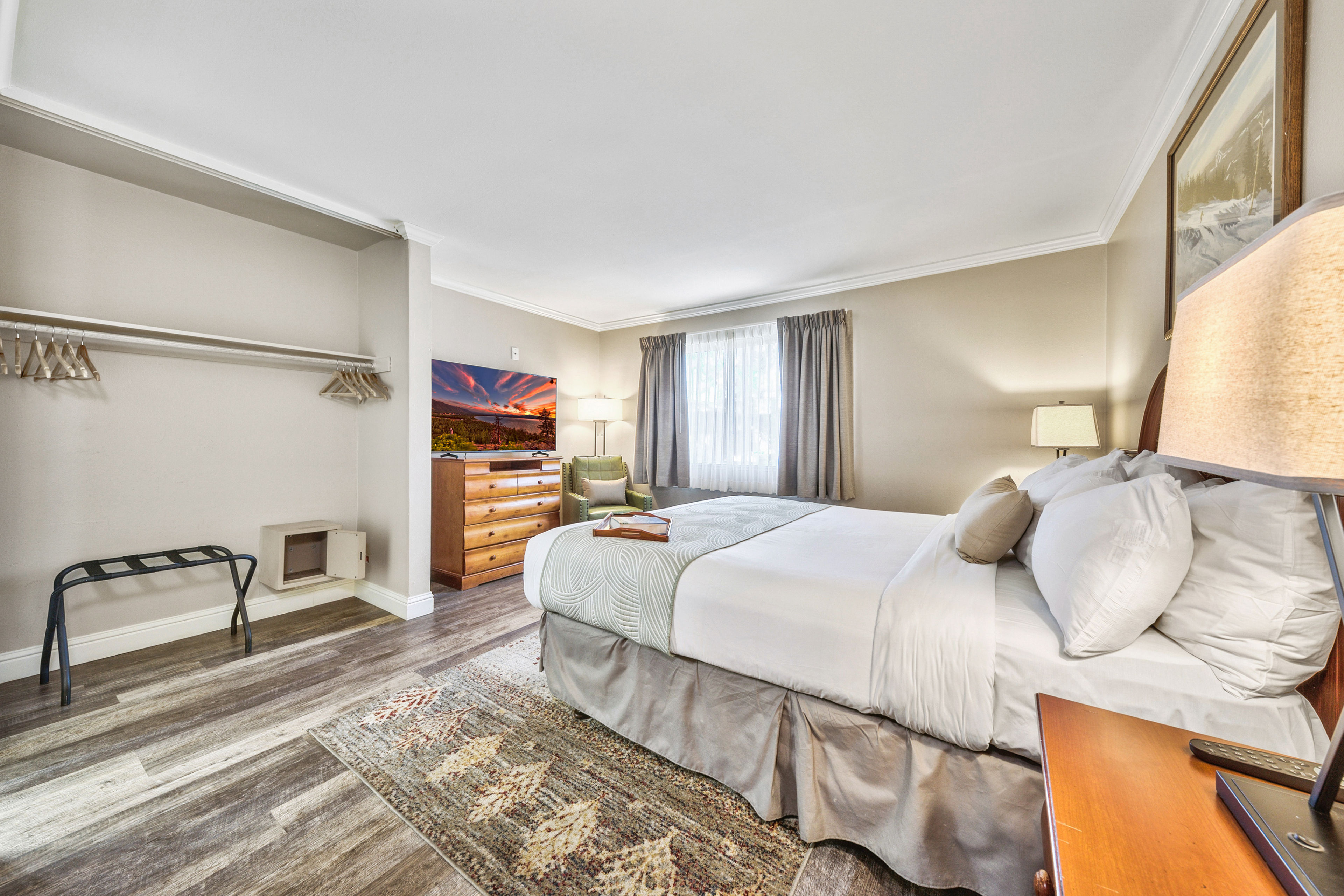 image A serene and inviting bedroom with soft lighting, plush bedding, and a cozy atmosphere—perfect for a restful night’s sleep.